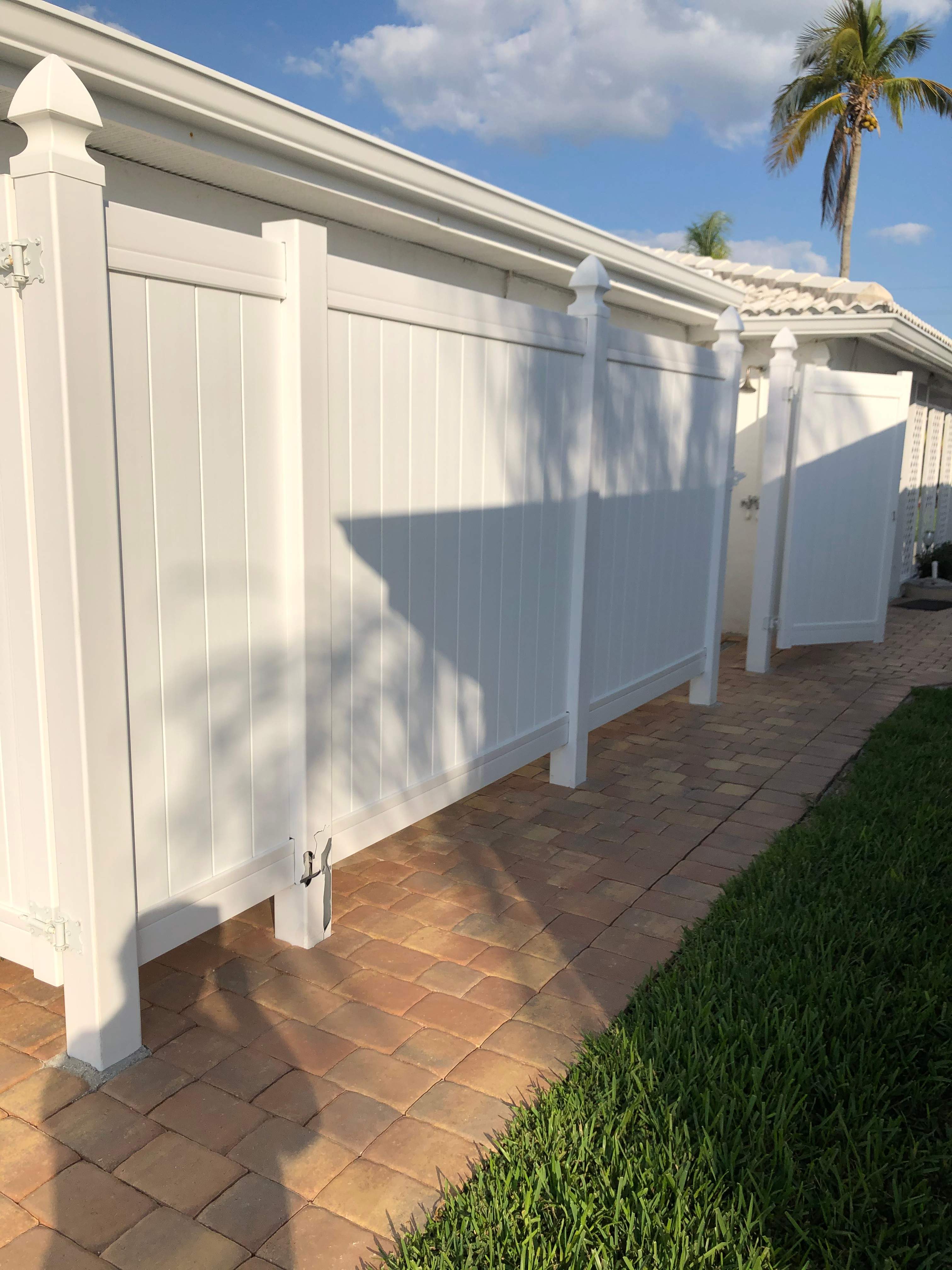Vinyl privacy fence installation used as a shower enclosure.  by Asap fence and gates, LLC