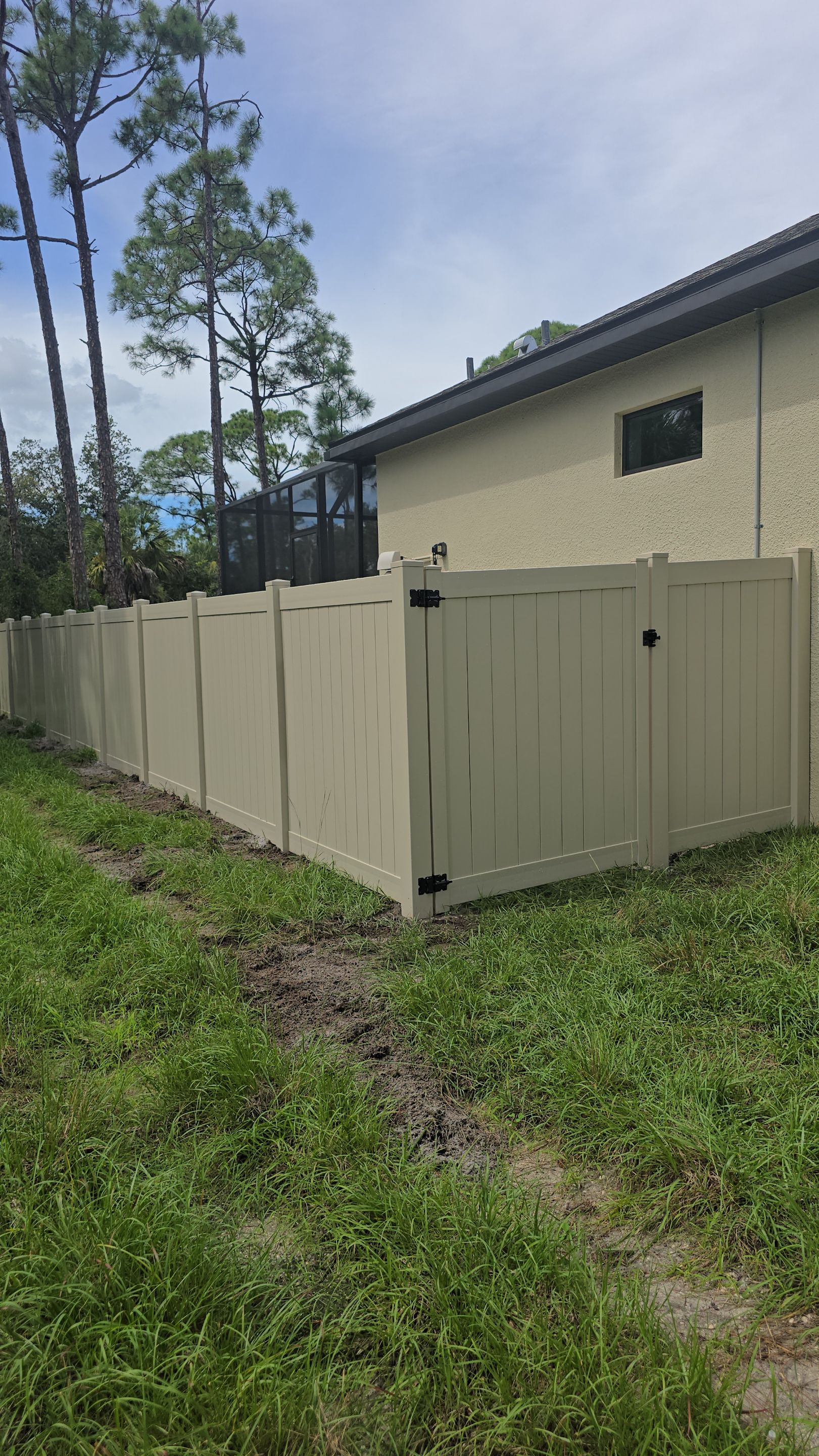 Tan Vinyl Privacy Fence and Gate Installation in Port Charlotte by True Fence LLC