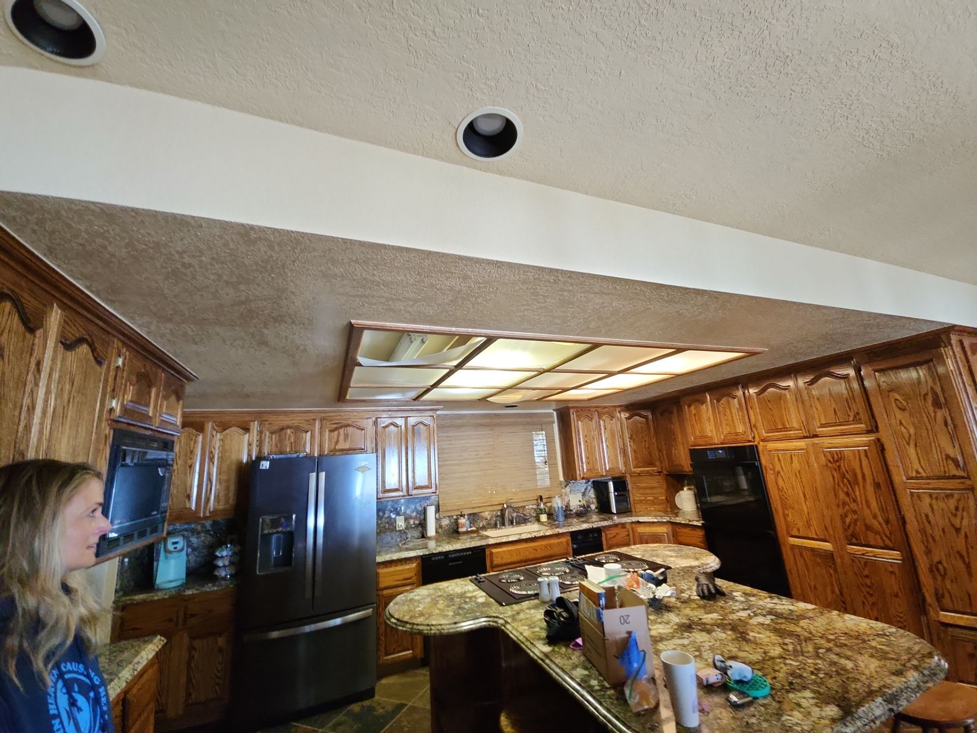 Kitchen Lighting/Siding Repair by The Tahoe Tradesman