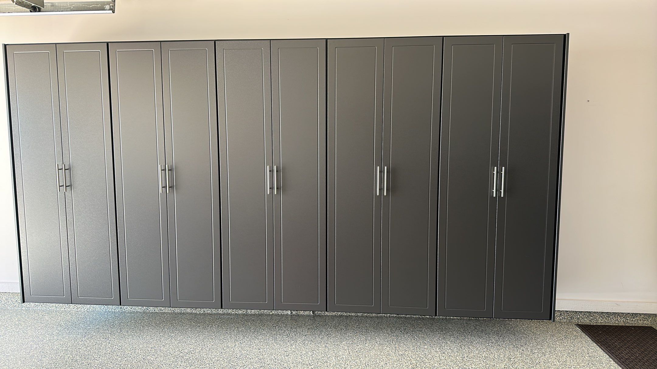 Lori H. upgrade her garage with cabinets and overhead racks by Banner Garage