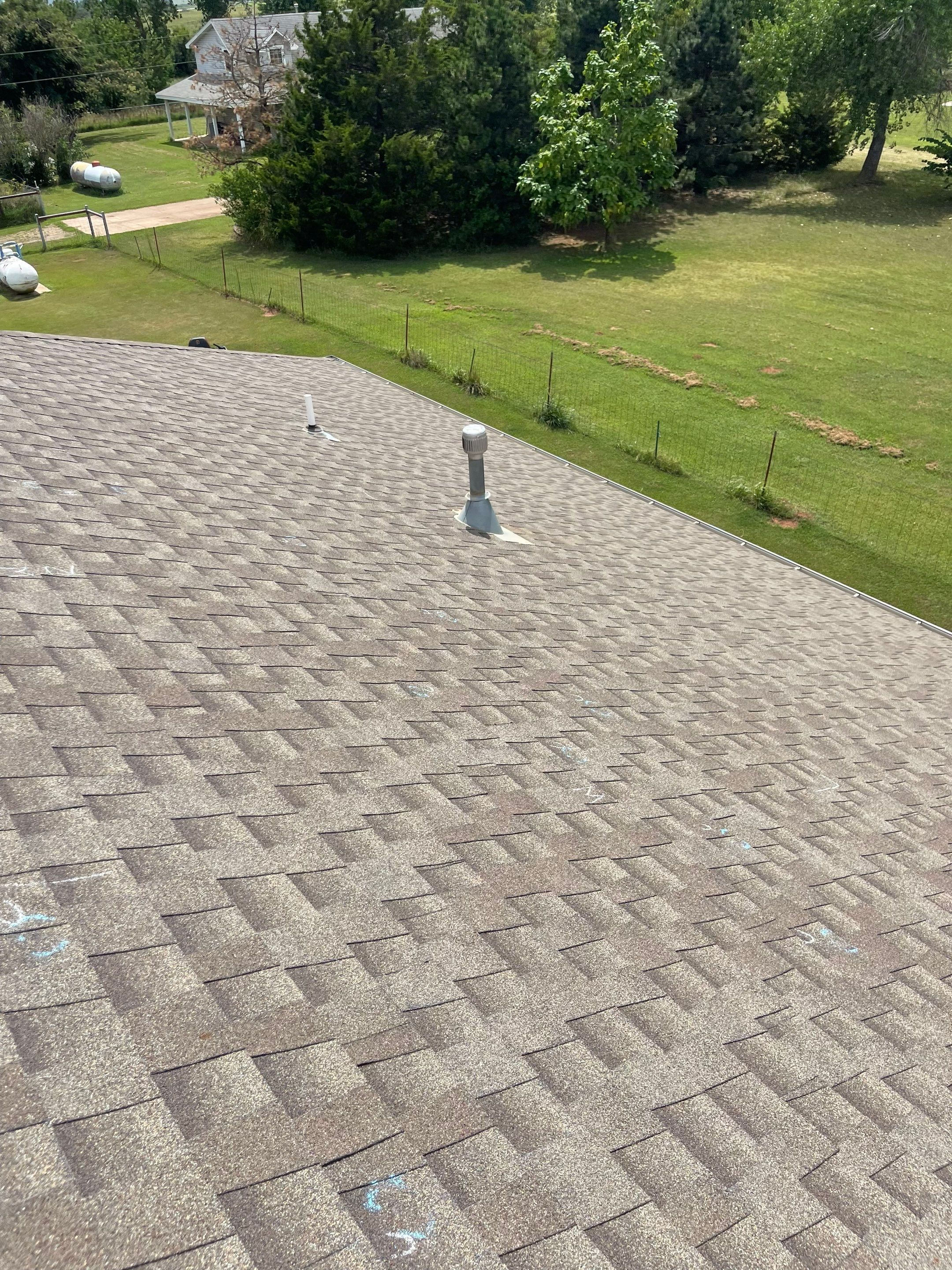 Hail Damage on a Roofing System by Icon Roofing And Construction 