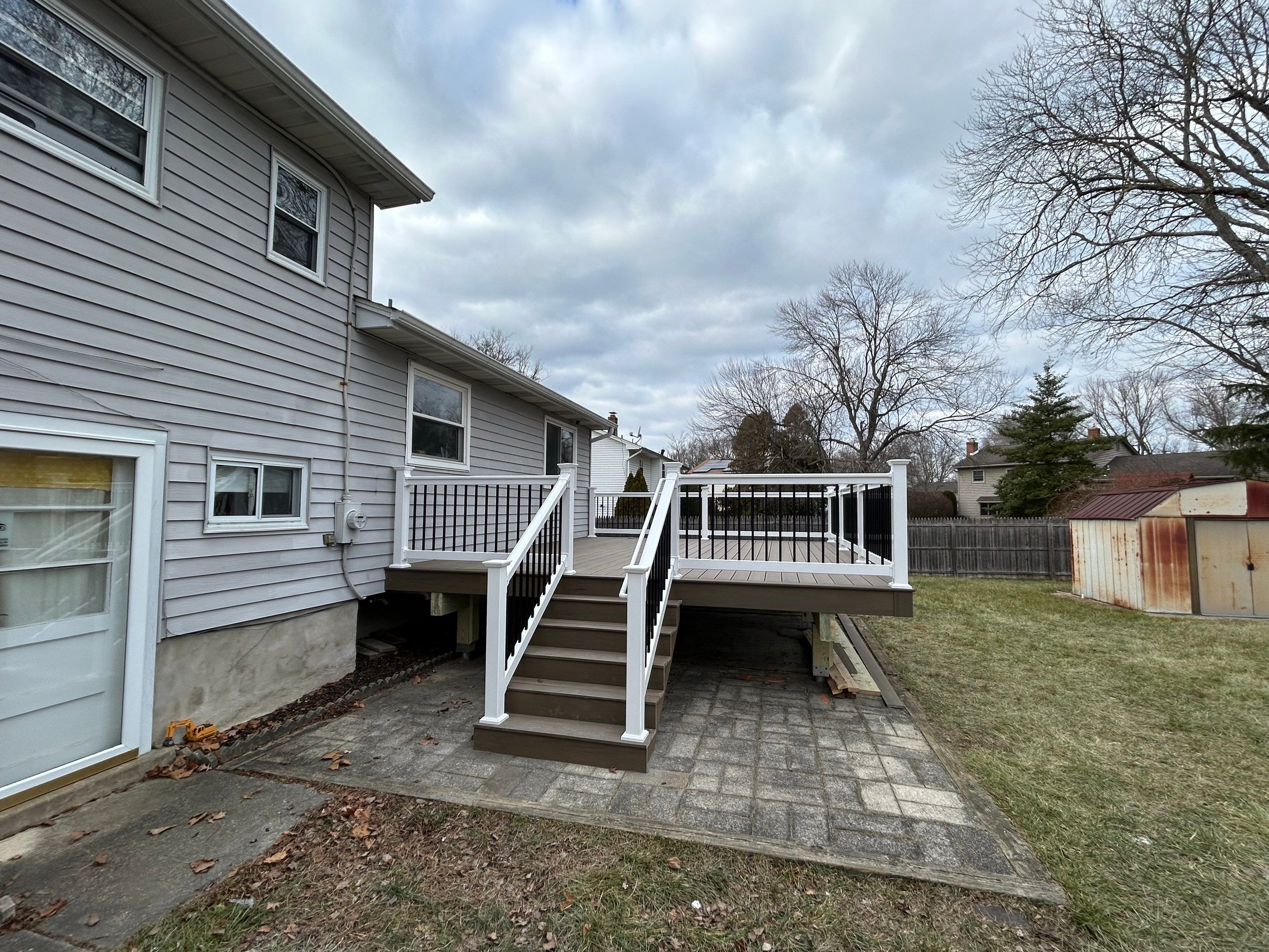 New deck construction and replacement of window with new sliding door  by deck guardian