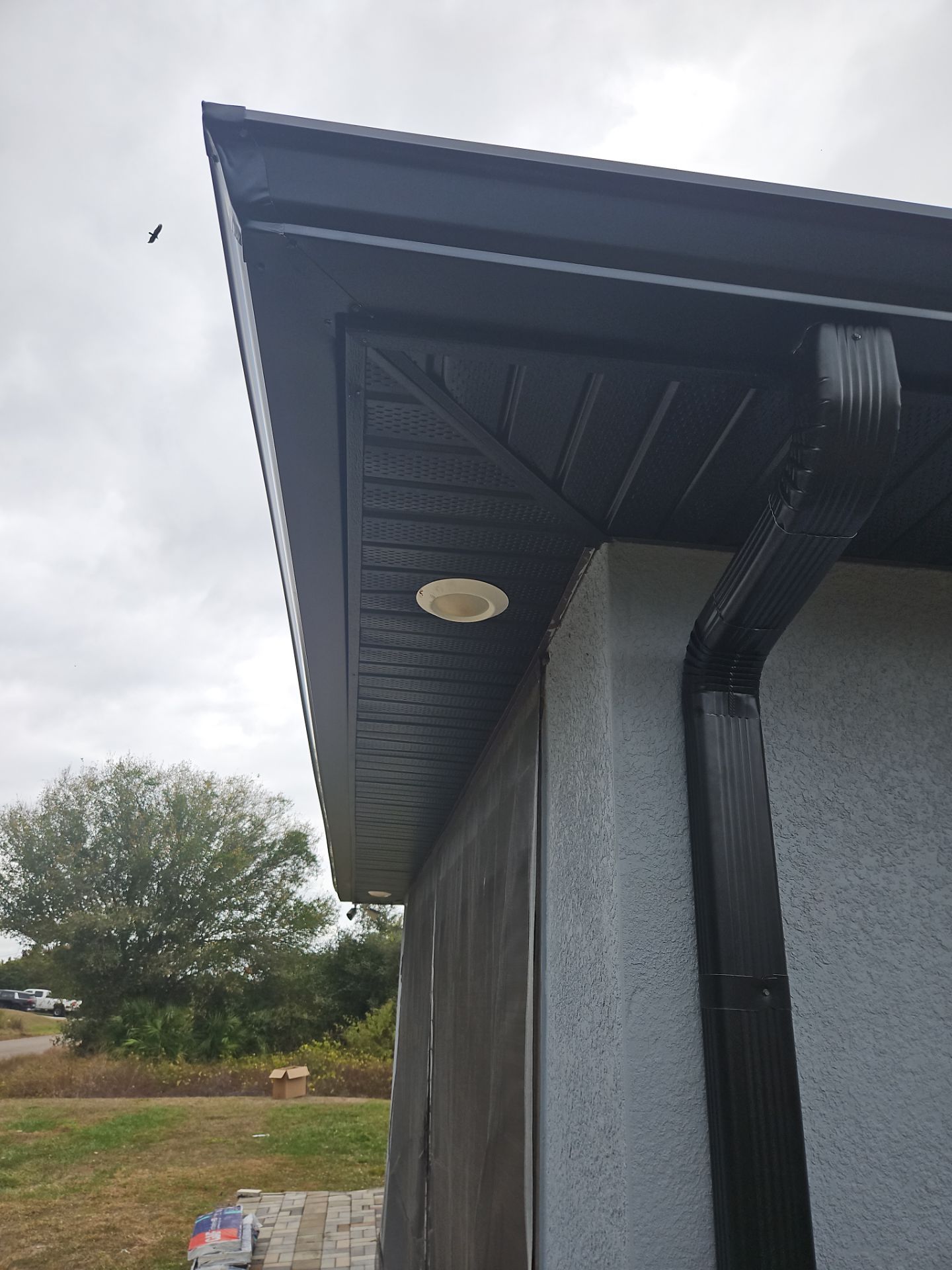 Black Seamless Gutters & Soffit/Fascia in Lehigh Acres FL by Gutter Professors