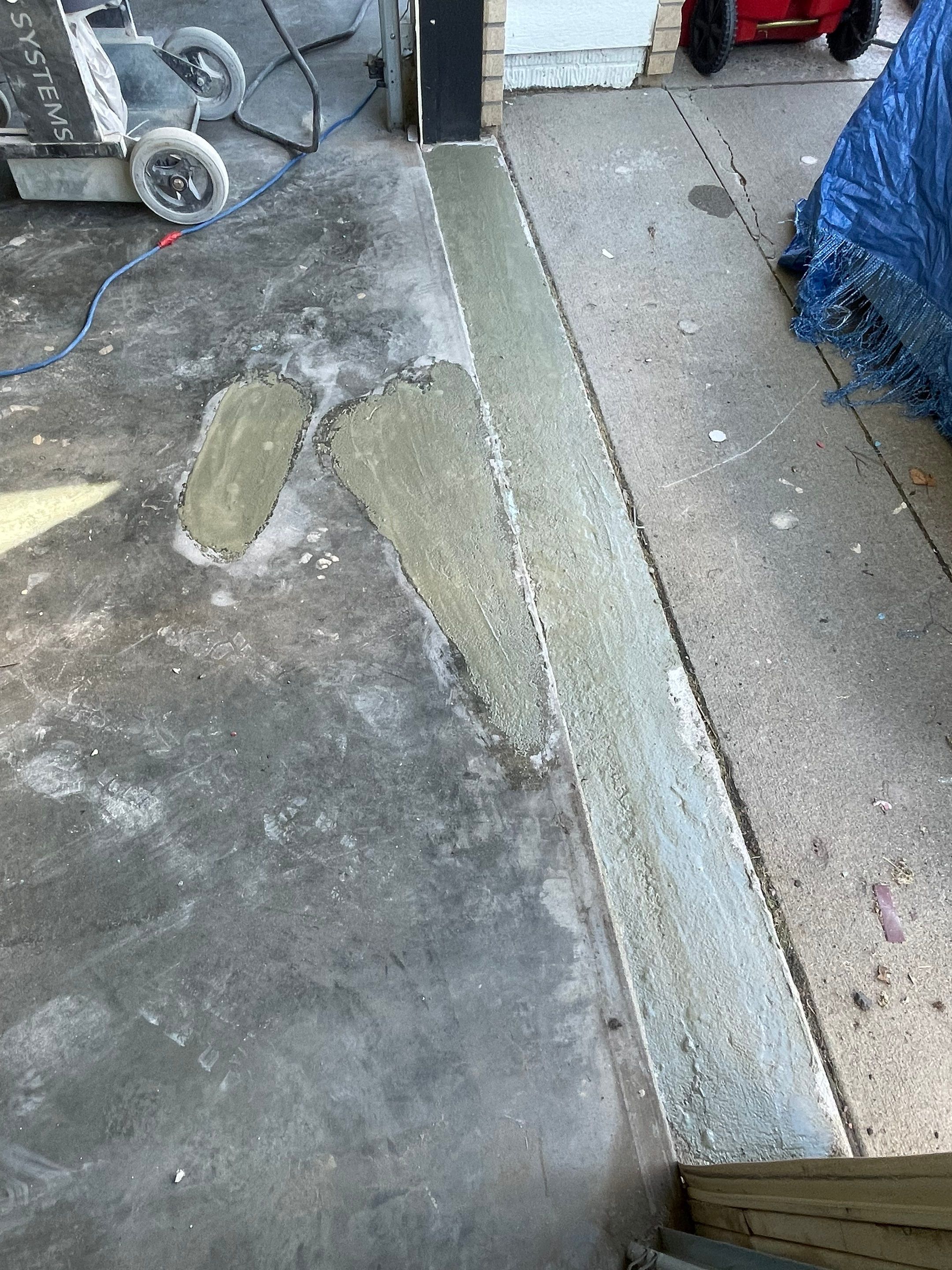 Cabin FEver Flake Garage Floor Coating Installation in Sioux Falls by Select Painting, Coatings & Garage Cabinets