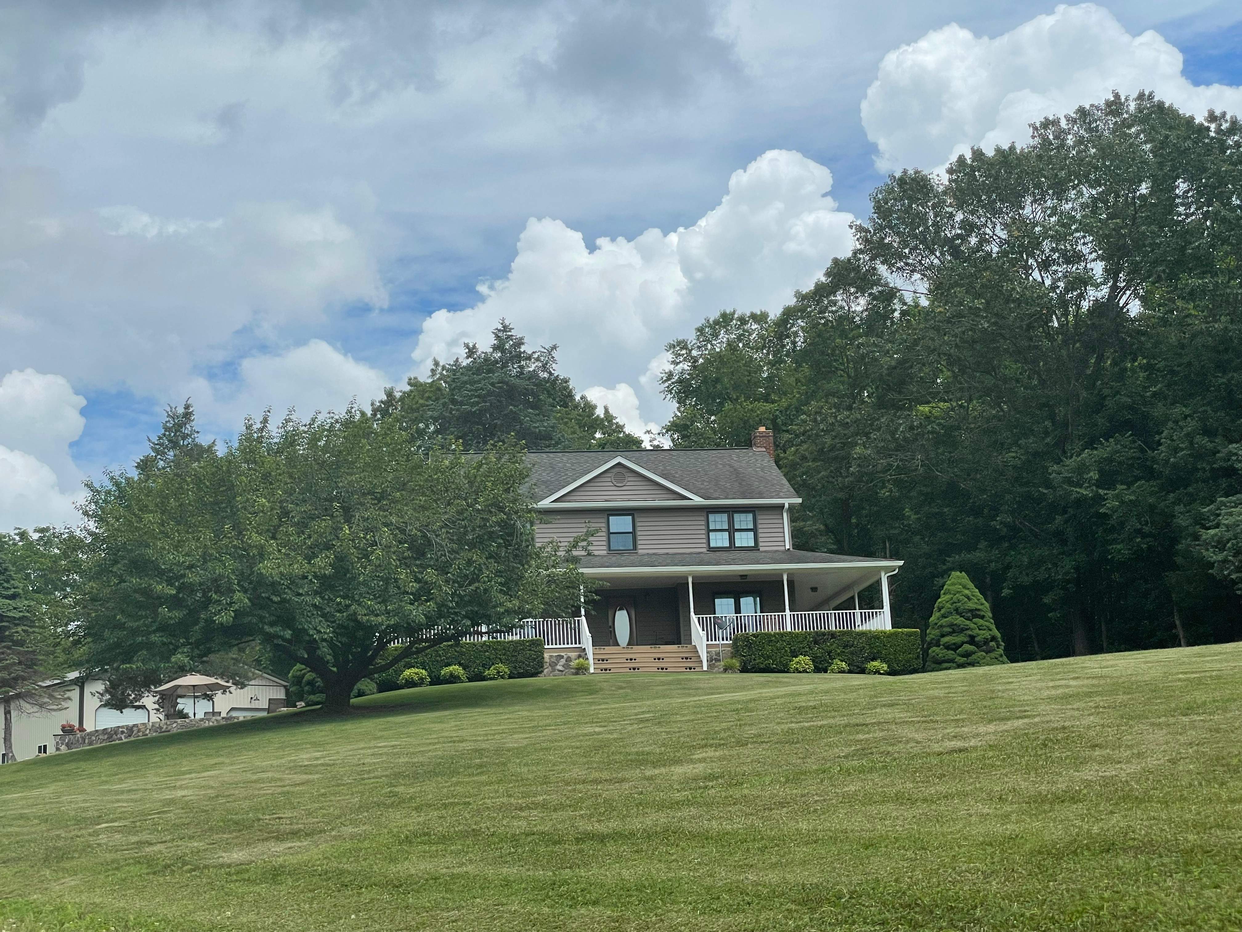 Exterior remodel including window replacement by American Home Contractors