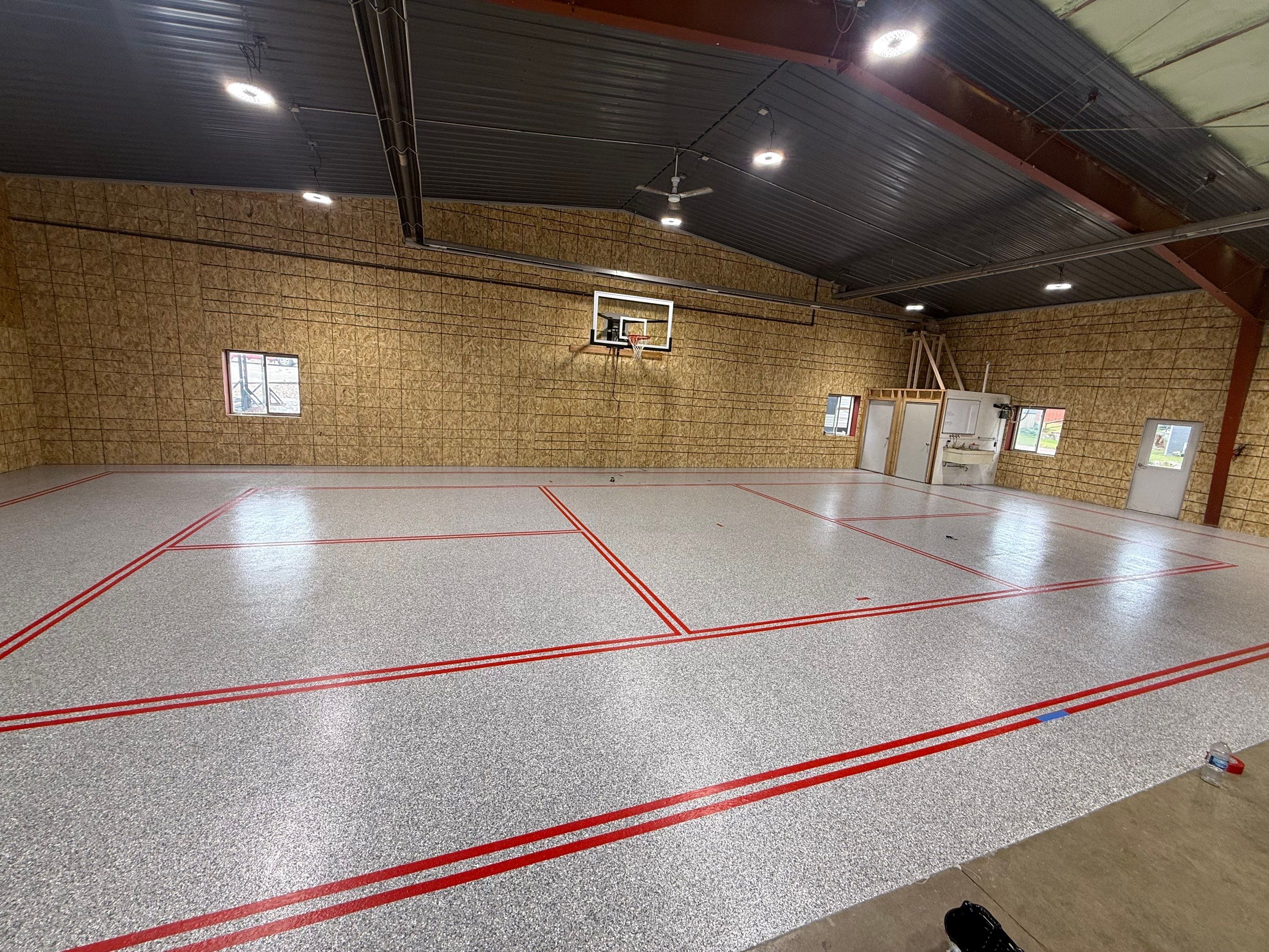 Custom Polyurea Shop Floor with Basketball Court Lines in Rock Valley by Select Painting, Coatings & Garage Cabinets
