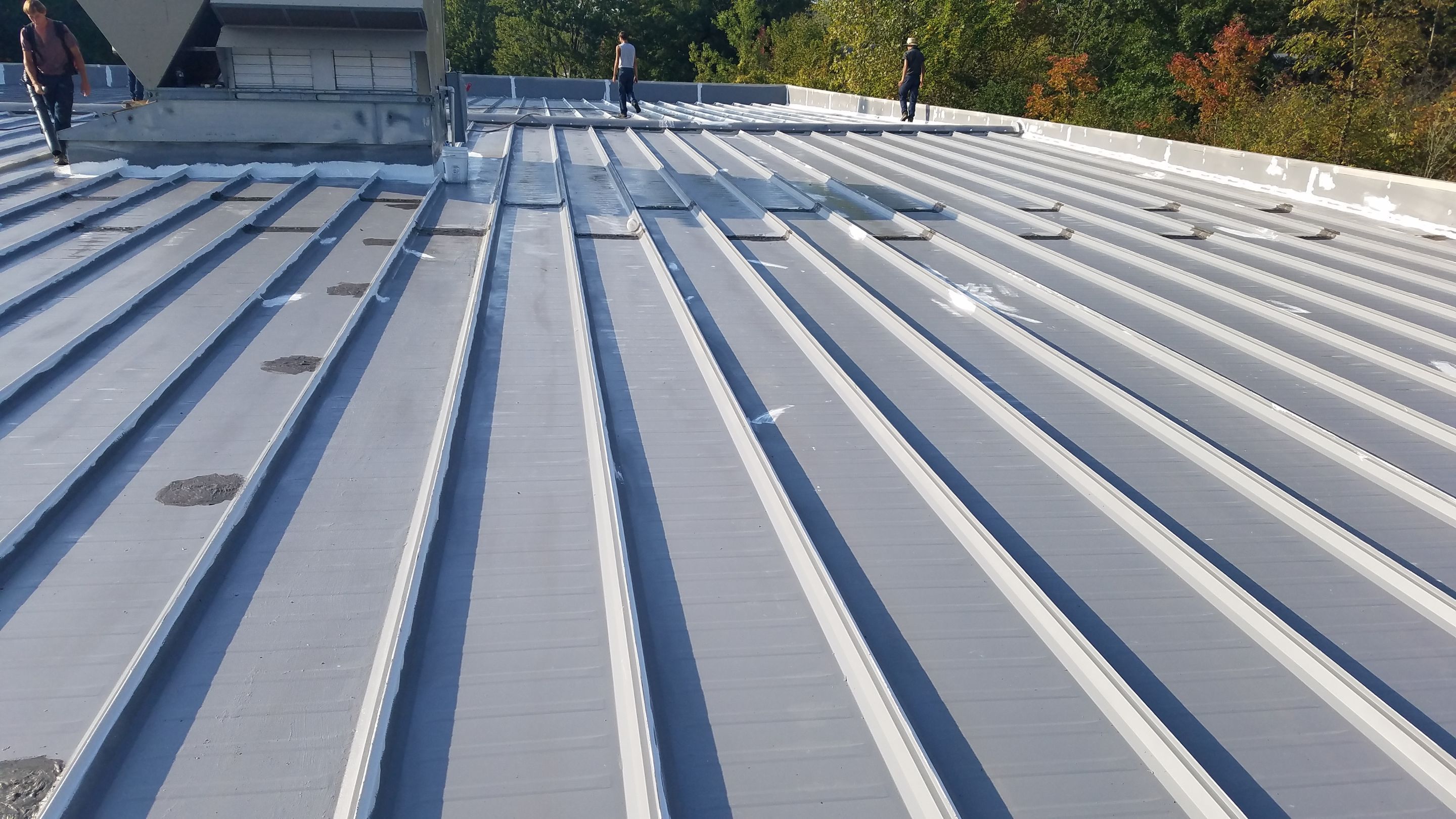 Commercial Metal Roof Coating by Gold Star Roofing LLC