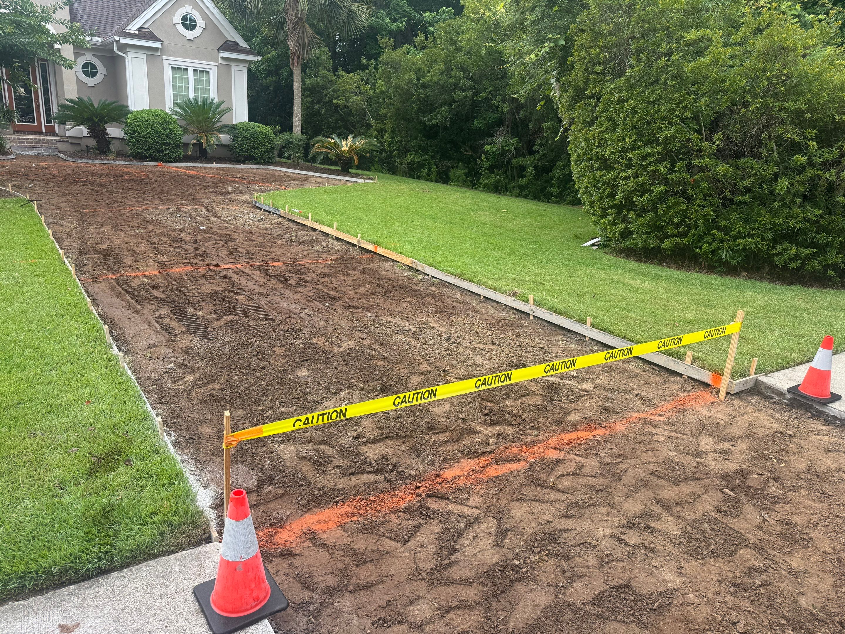Custom Concrete Driveway and Decorative Paver Installation in Bluffton by Lowcountry Scapes, LLC