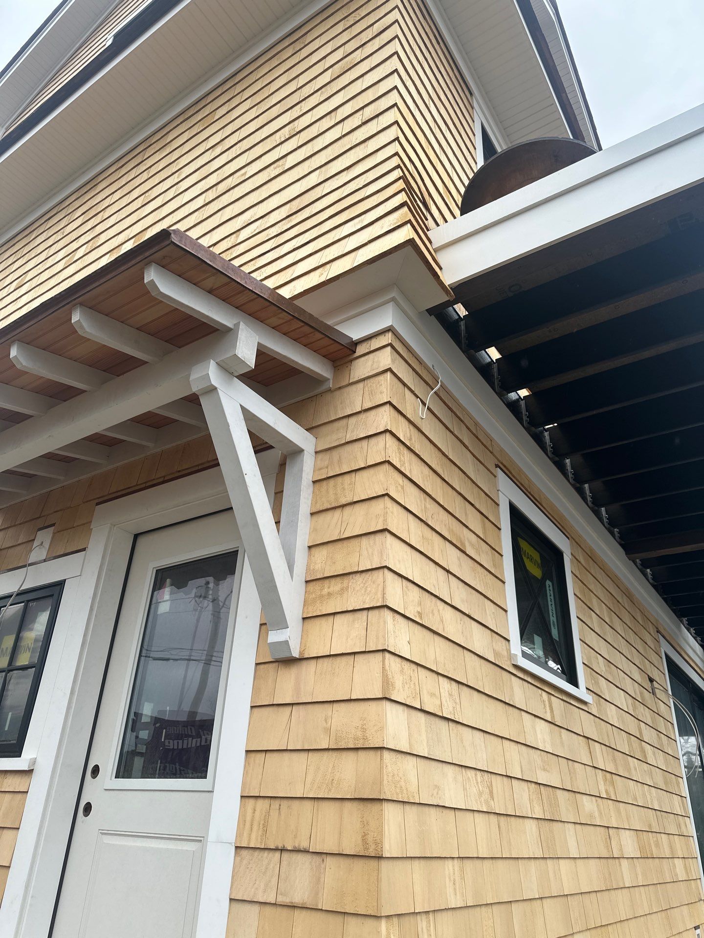 Great Island - Red Cedar Roofing, Yellow Cedar Siding, Standing Seam Copper, & Copper Gutters  by Rinaldi Brothers
