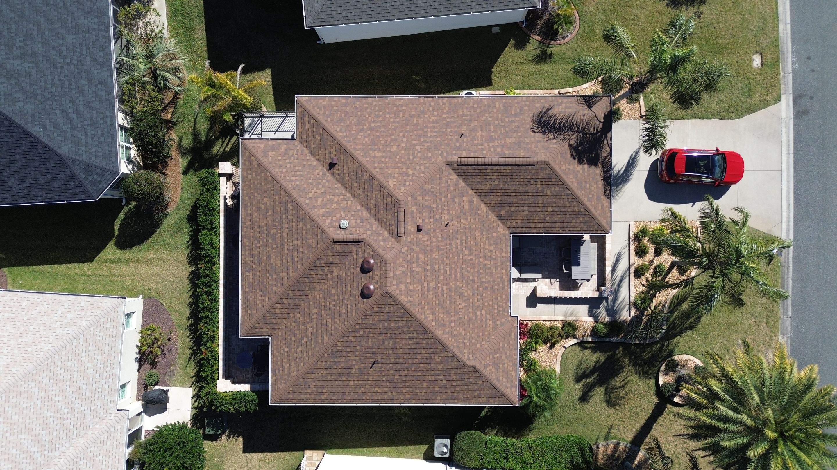Florida roofers installing shingles by Brehm Roofing