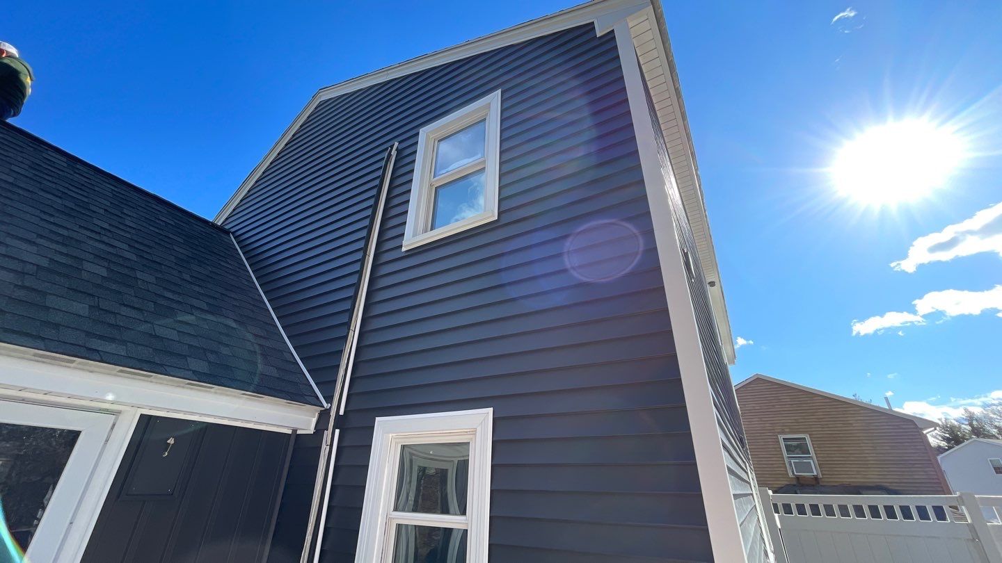 Complete Exterior Renovation with New Siding & Gutters   by Sensible Home Solutions