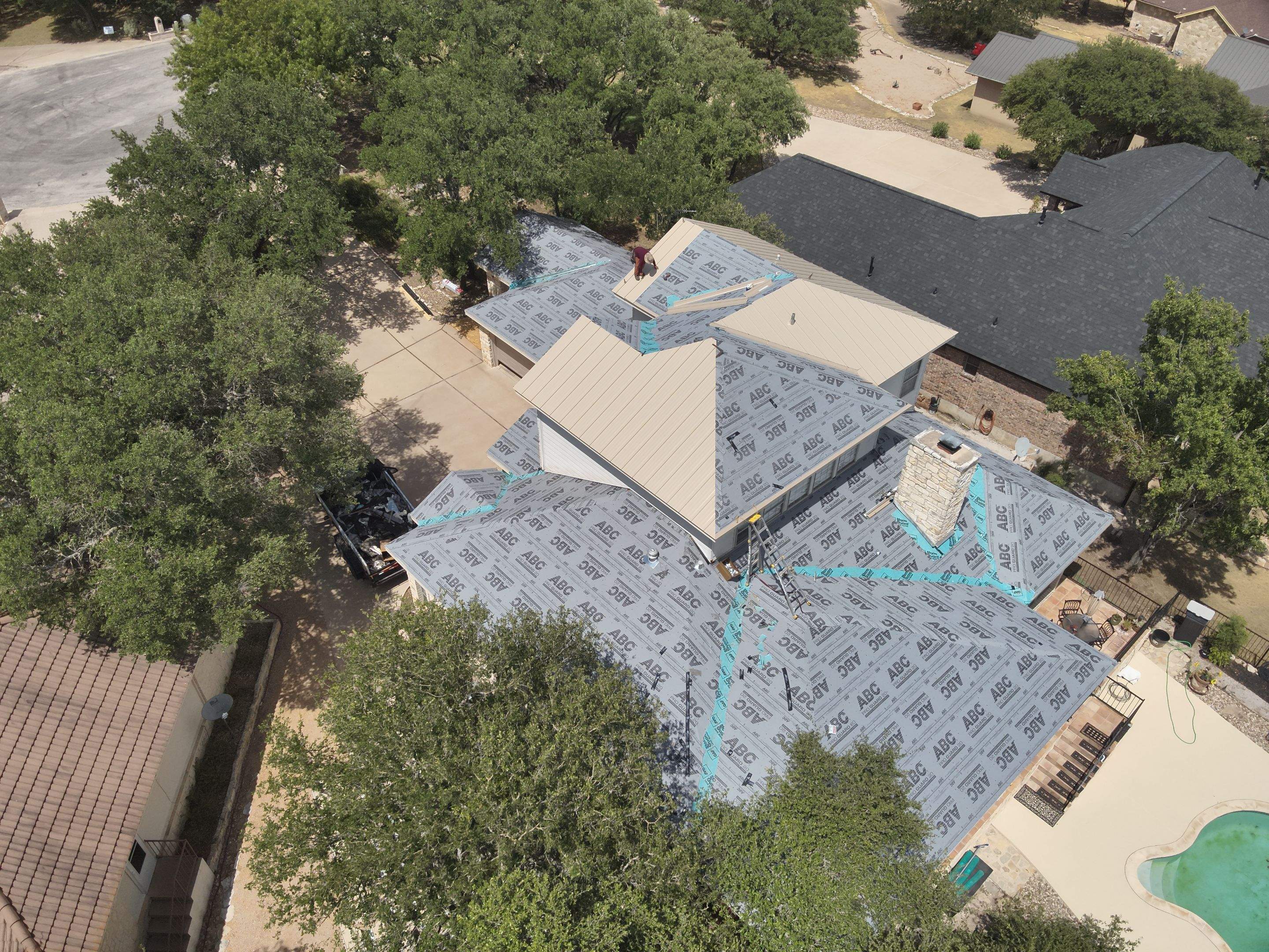 Residential Roof Replacement using 24 GA Double-Lock - Surrey Beige by Action Exteriors Austin