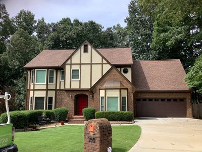 Complete Exterior Painting and Trim Refresh for Roswell Tudor Home