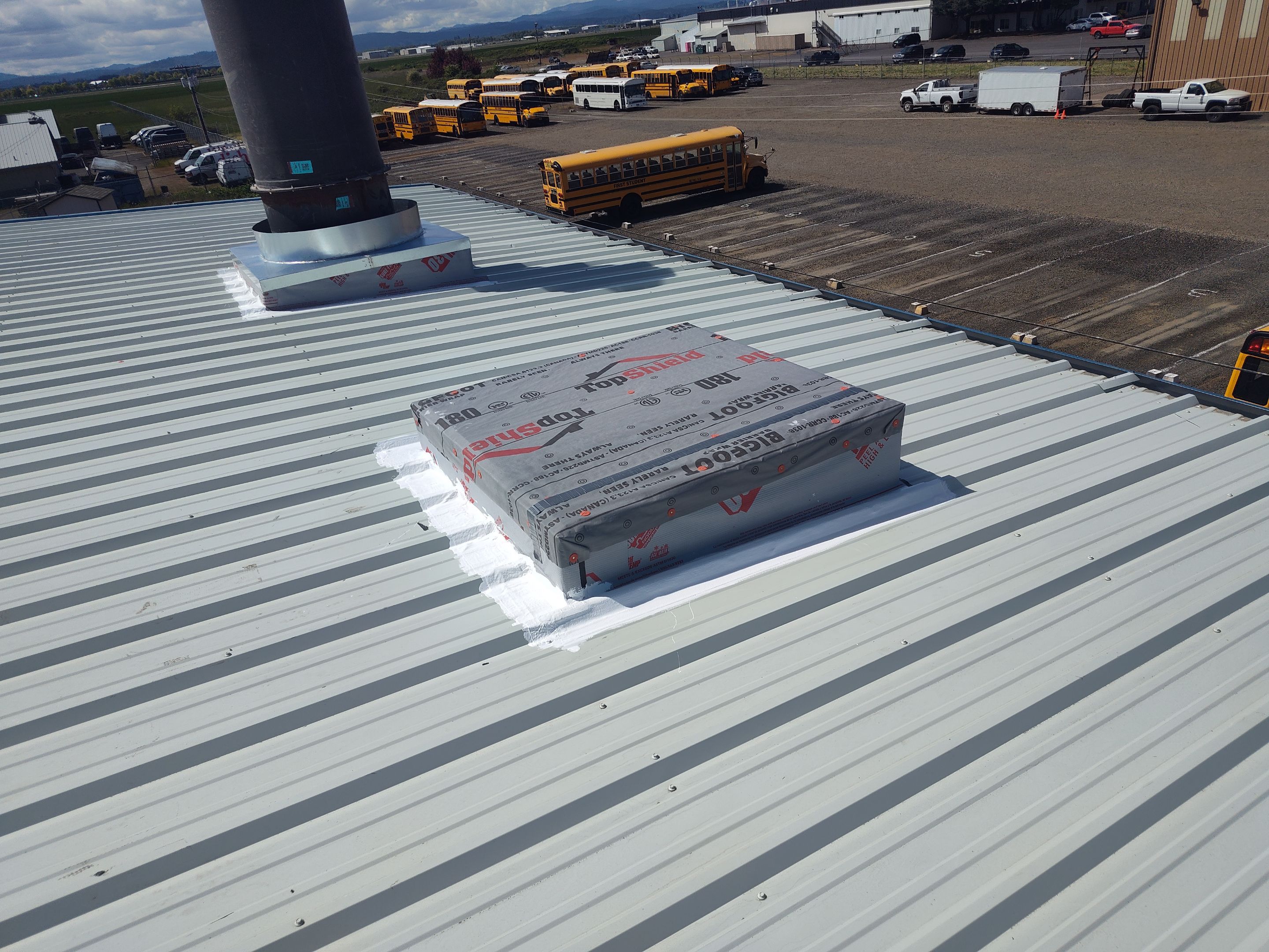 Installing New Curbs on a Metal Roof for new equipment by BEST Roofing & Waterproofing