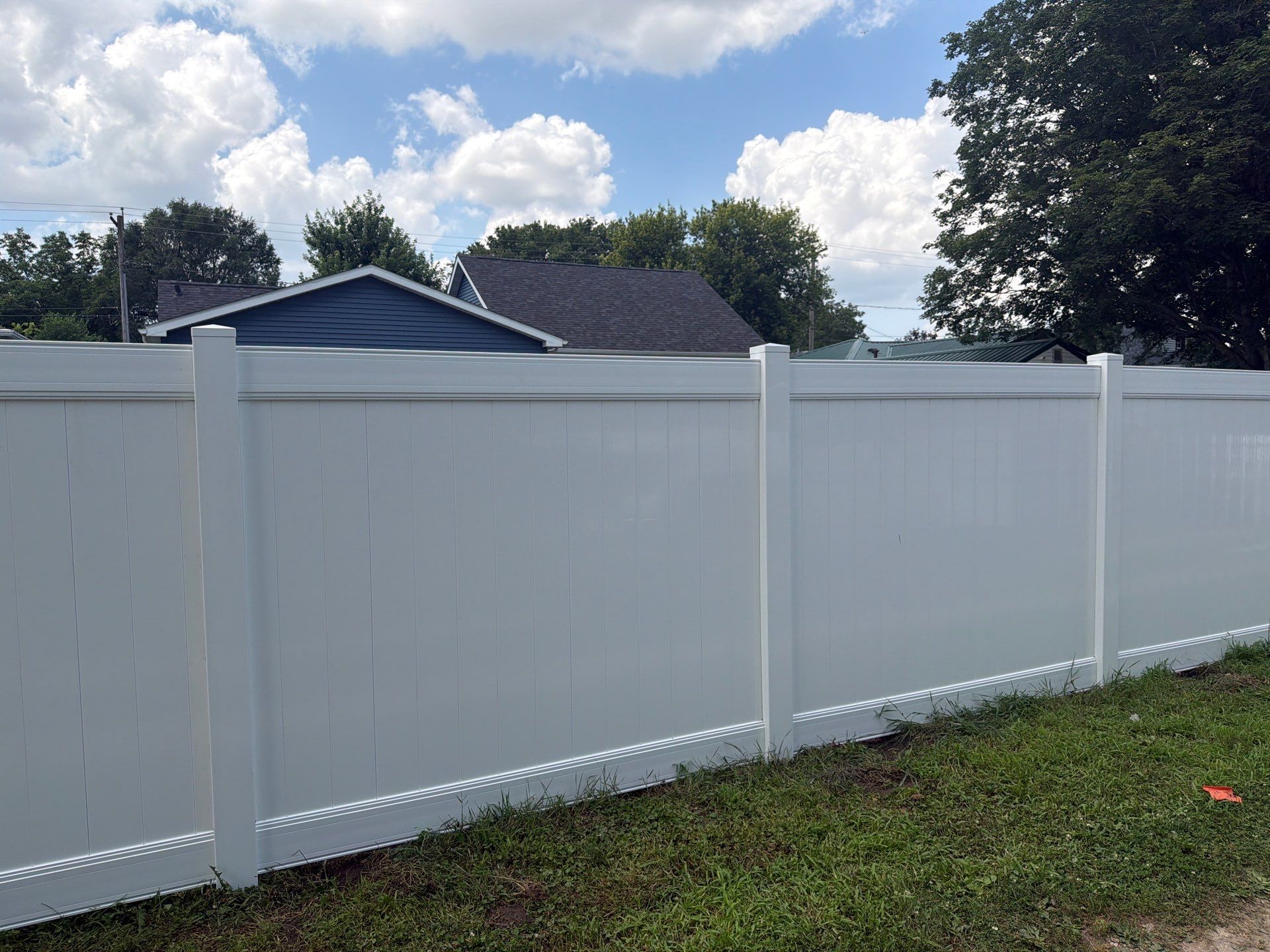 White Vinyl Privacy Fence Installation in Waterloo, Iowa by Perfect Picket Fence and Stain