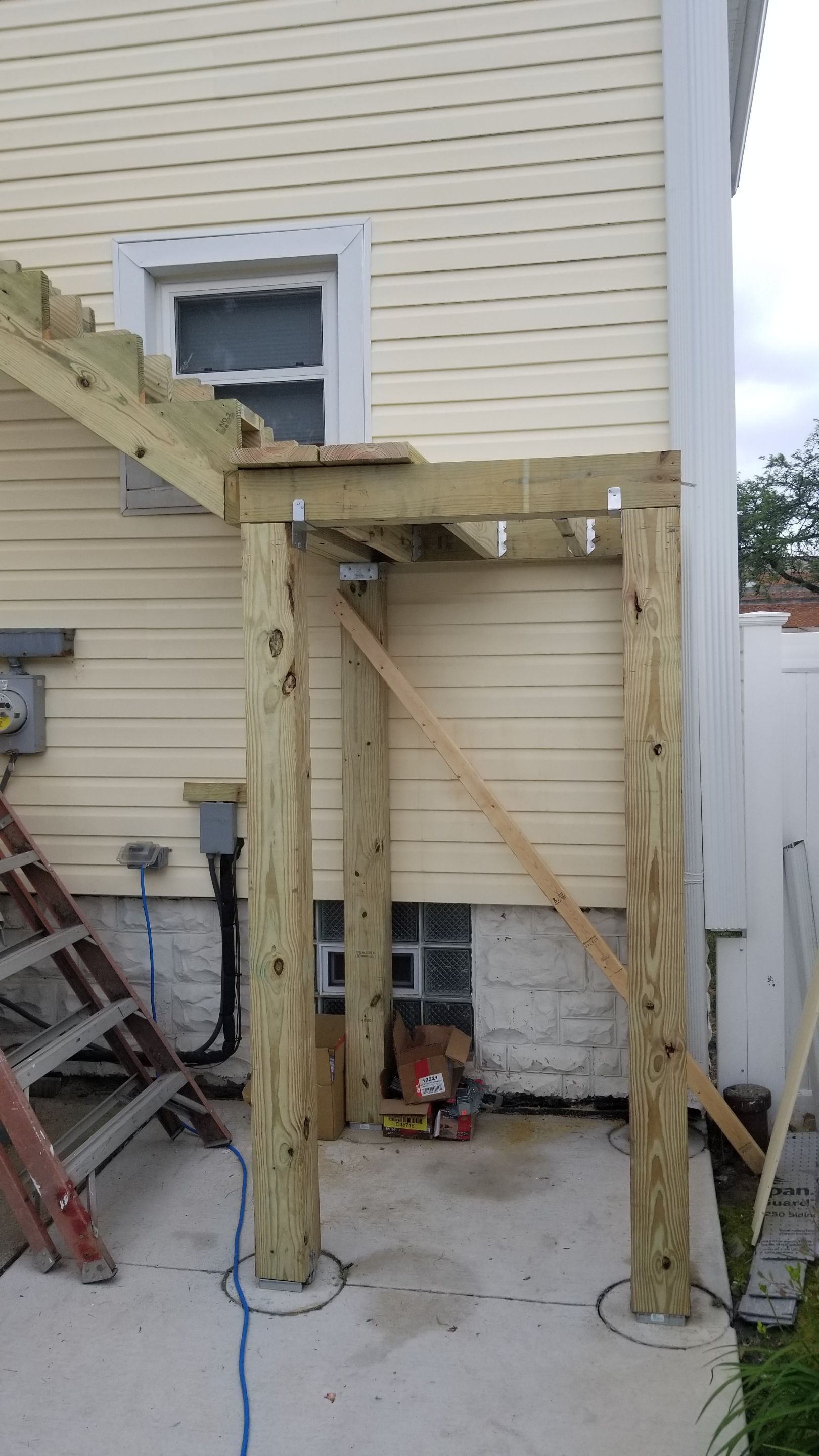 Rebuild balcony flat roofing TREX decking stairway and Railings in Wyandotte, MI by Northwest Construction 