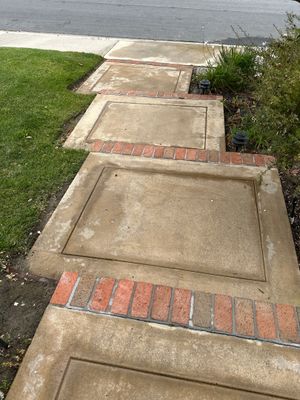 Driveway, patio, and rear entry walkway pressure washing in Orange County