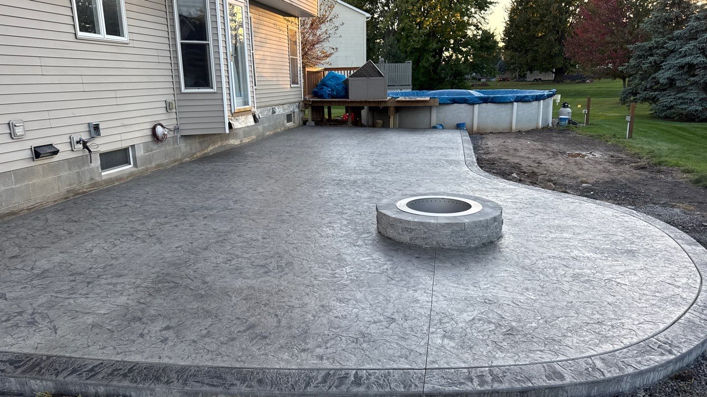 Oxford slate stamped concrete patio by NG Masonry & Construction LLC