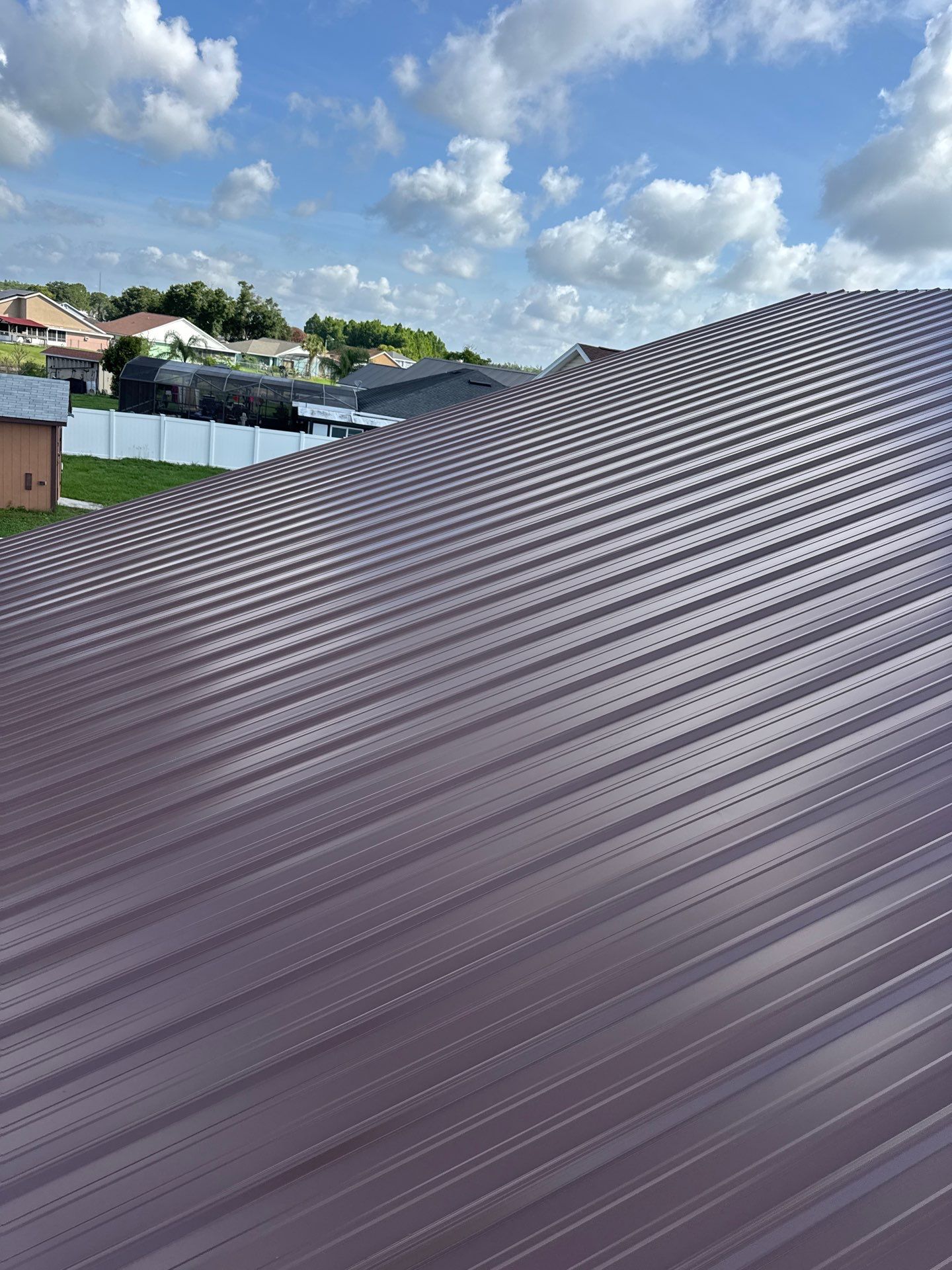 Residential Metal Roofing Installation and Gutter Replacement in Kissimmee by Pinnacle Roofing Group
