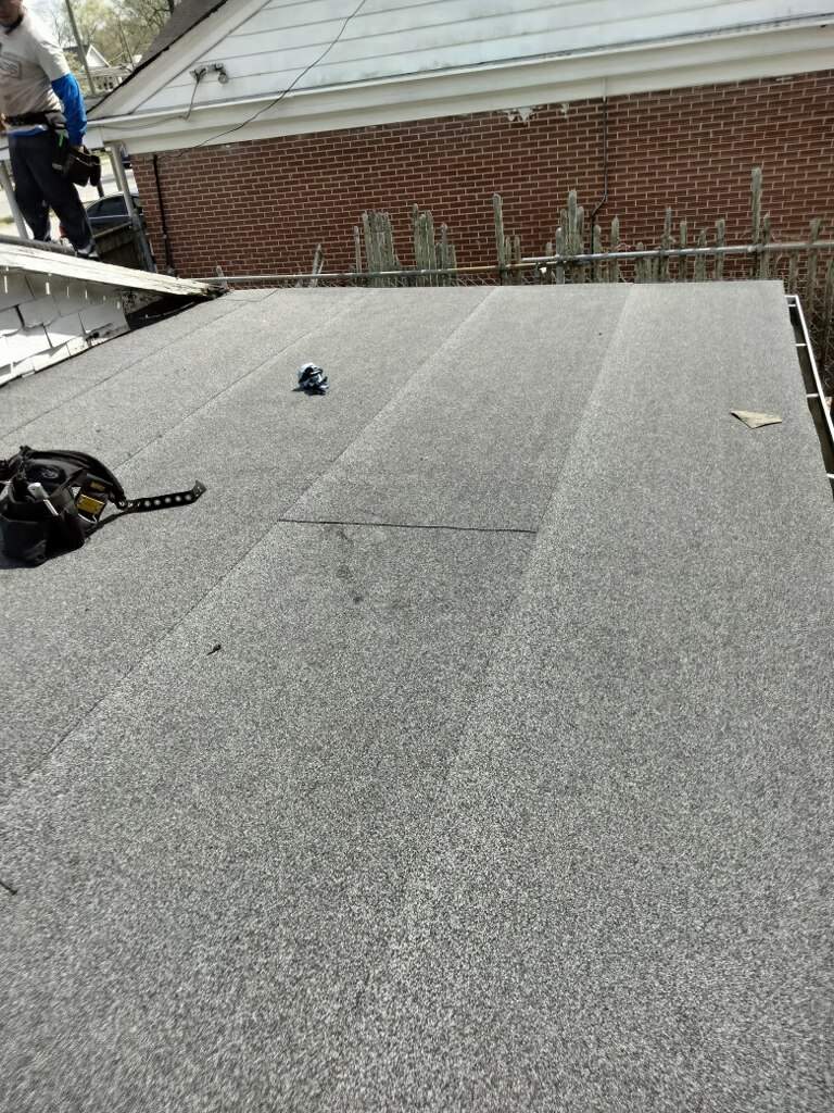 memorial tattoo roof & gutter replacement by Nailed It Roofing & Remodeling LLC