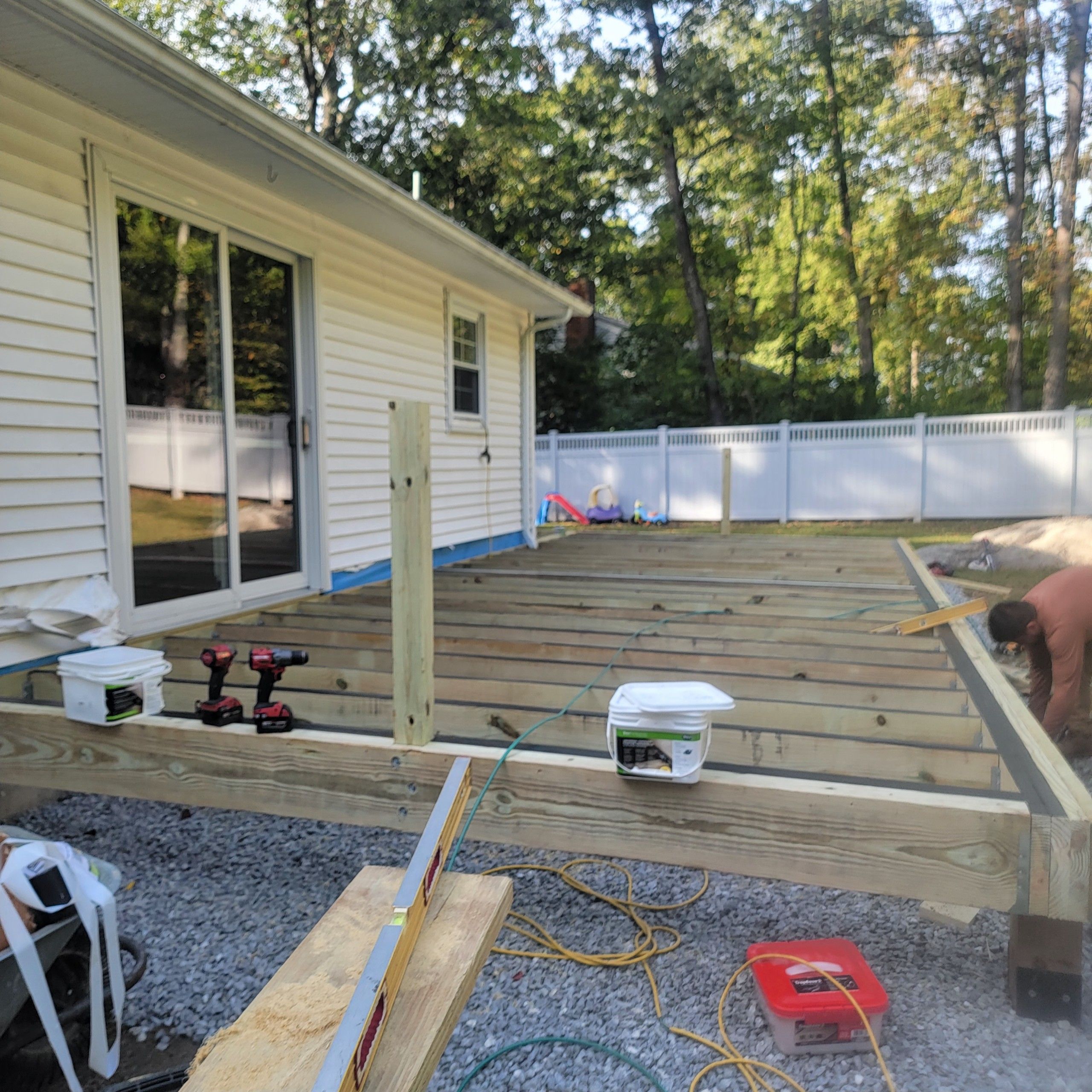 Deck replacement using Trex Transcend Rope swing and Transcend cocktail rail and trex lattice  by DiGiorgi Roofing and Siding Inc