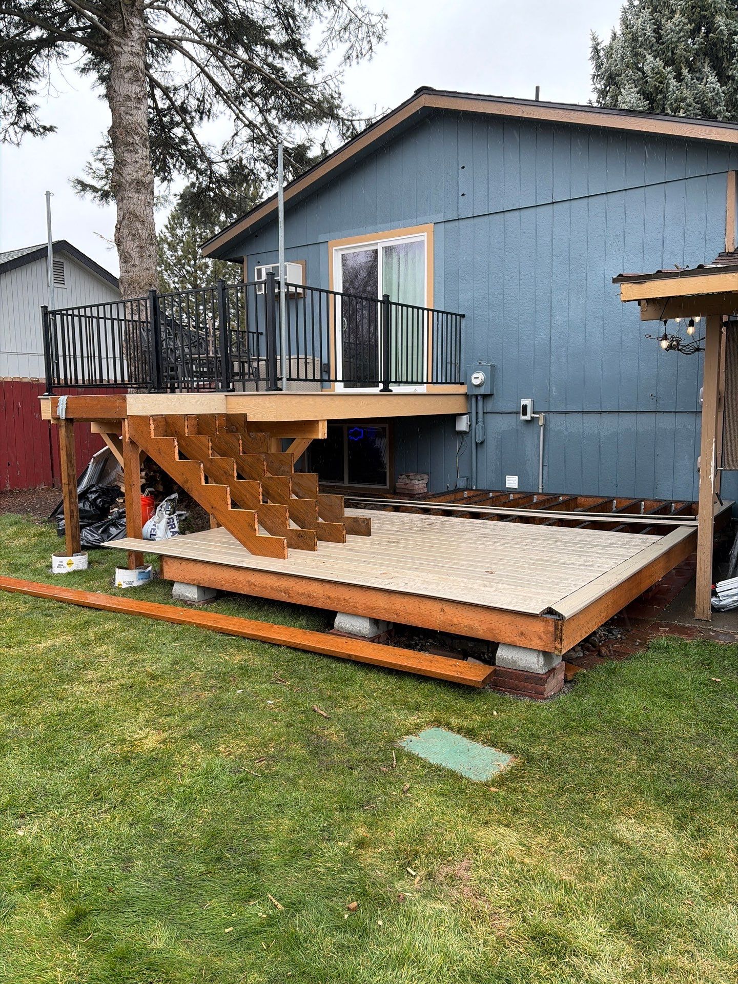 Add a platform deck below an existing elevated deck that was there prior by Home Helpers General Contracting