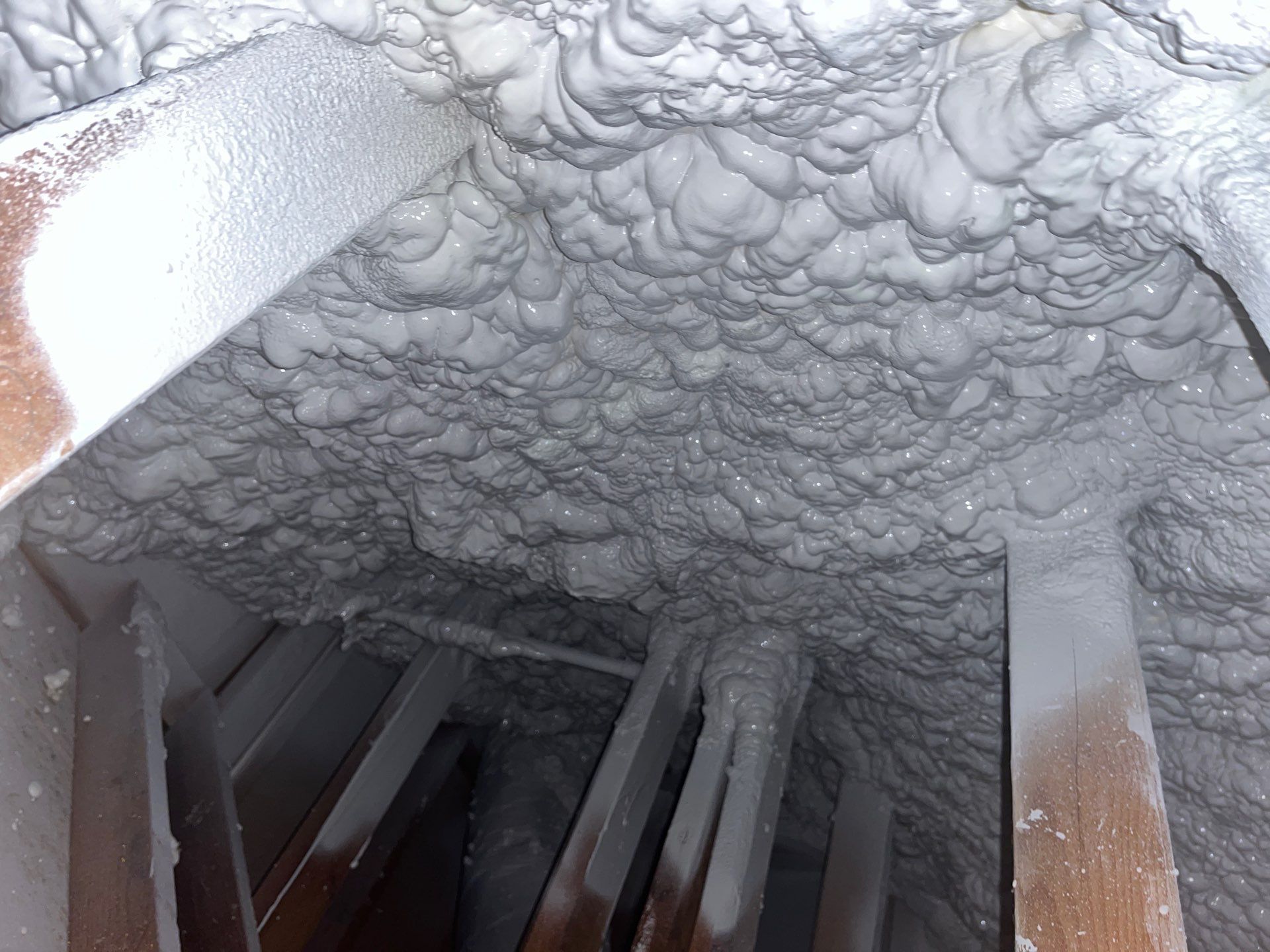 Attic Insulation using open cell spray foam by NYS Foam & Energy
