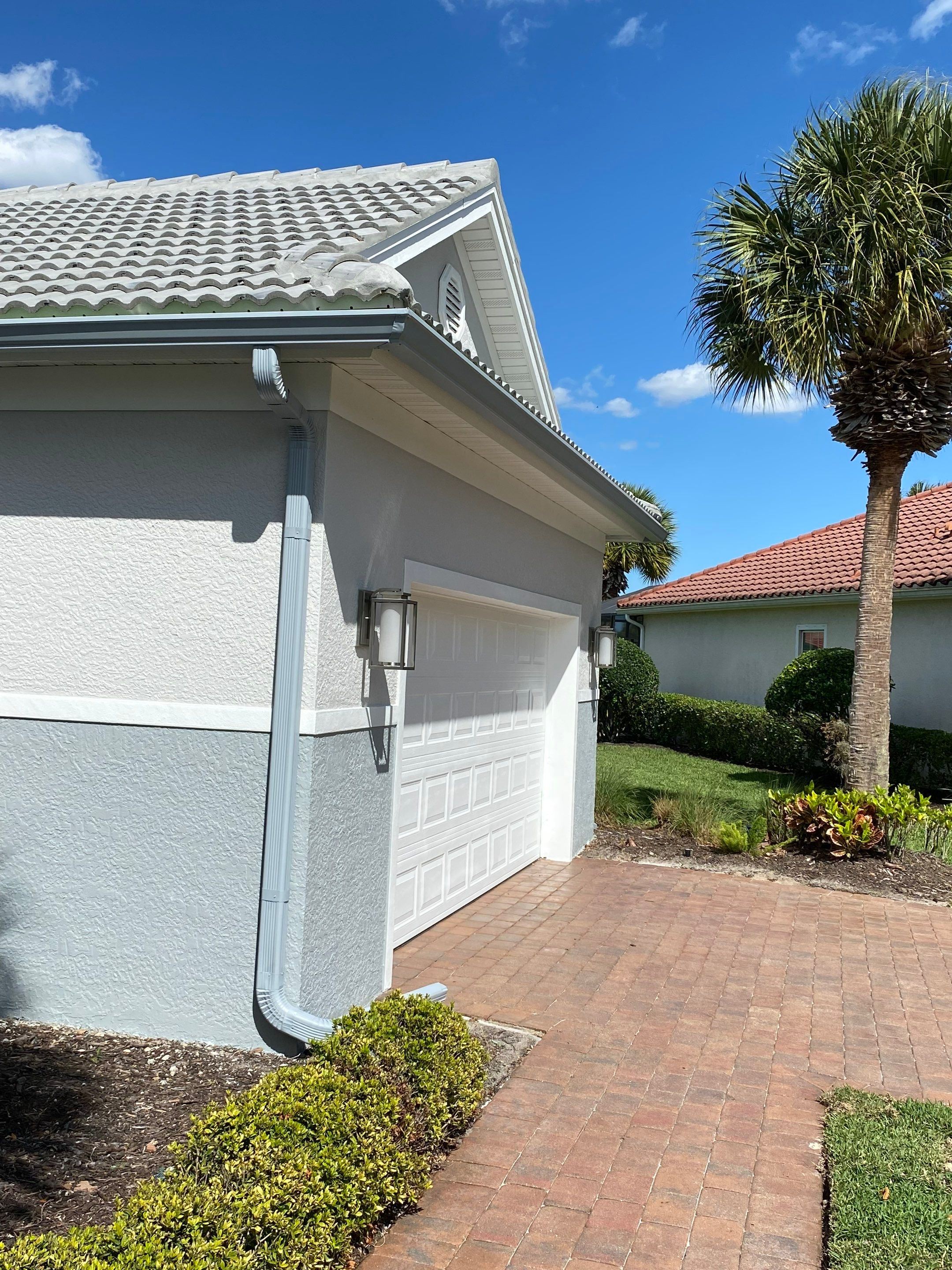 6-inch K-style Seamless Gutters and Splash Guard in Grey Color in Naples FL by Gutter Professors