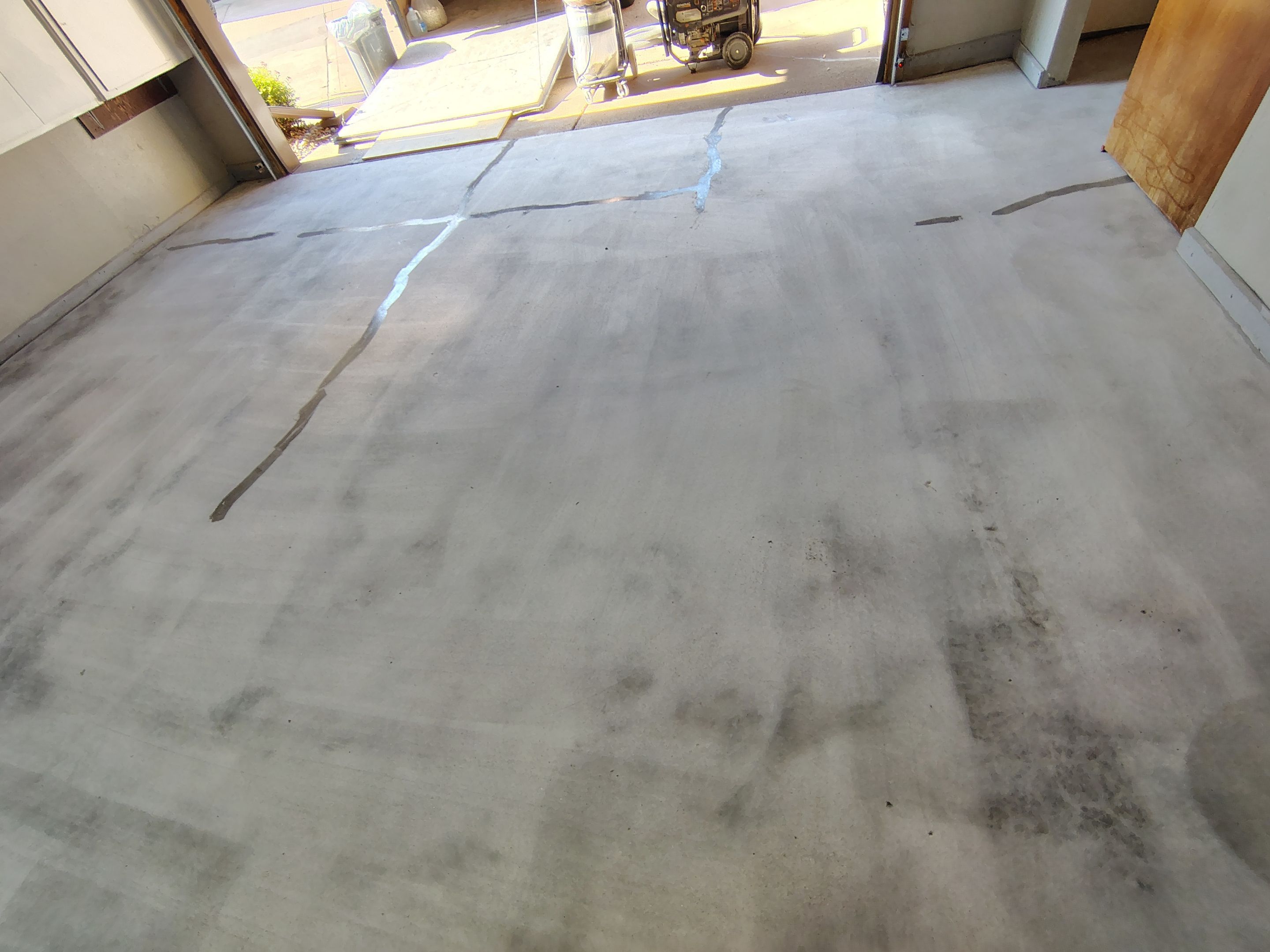 Domino Flake Garage Floor Coating Installation in Sioux Falls by Select Painting, Coatings & Garage Cabinets