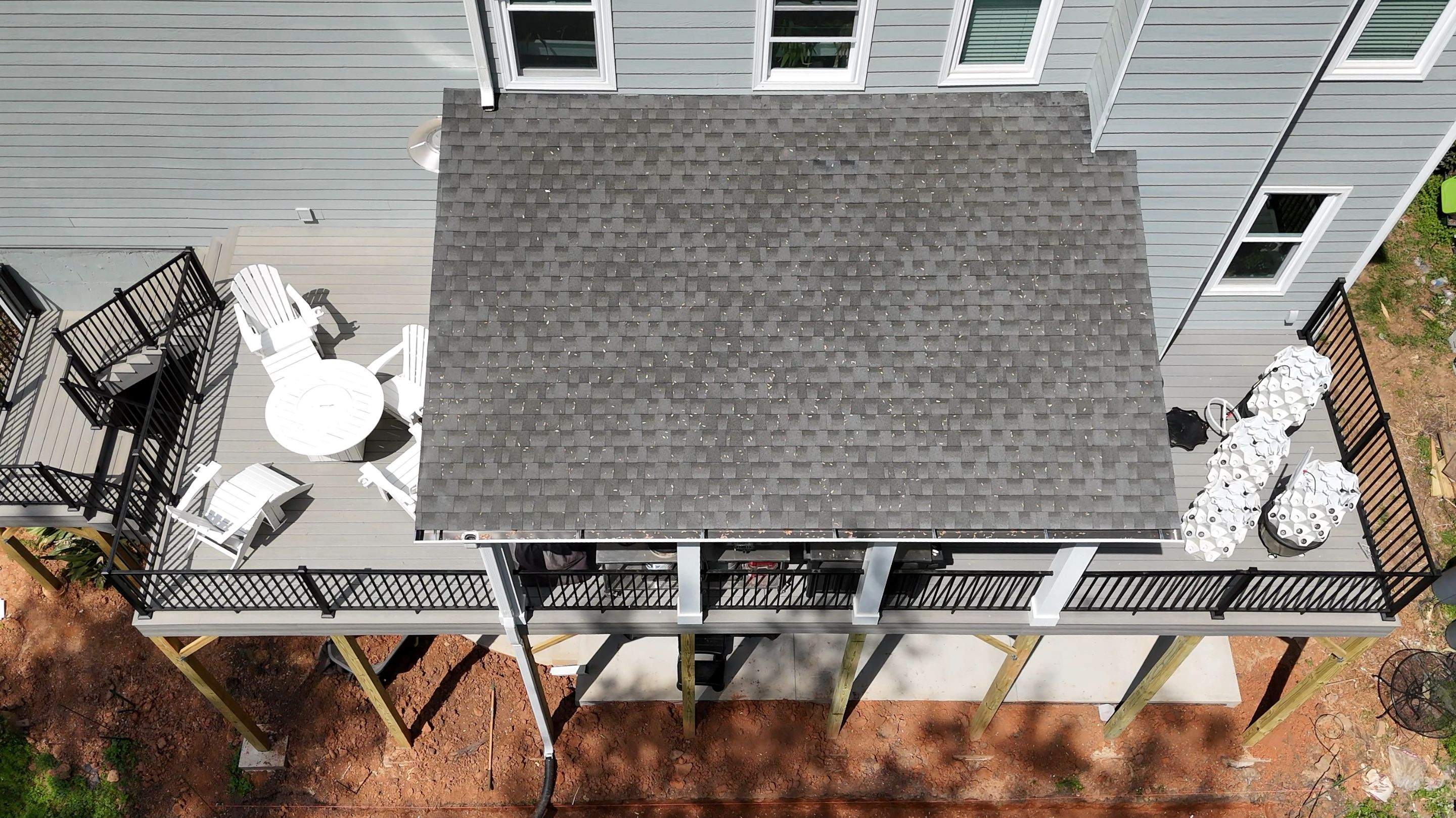 Covered Porch and Deck Build using Deckorators Venture Series Decking and Trex Select Aluminum Railing by Nelson Exteriors