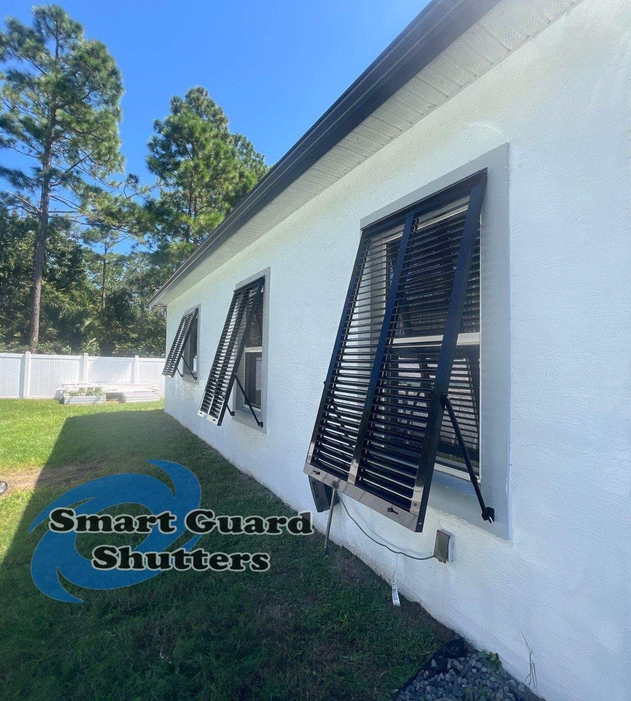 Impact Bahama Shutters in Jet Black by Smart Guard Shutters