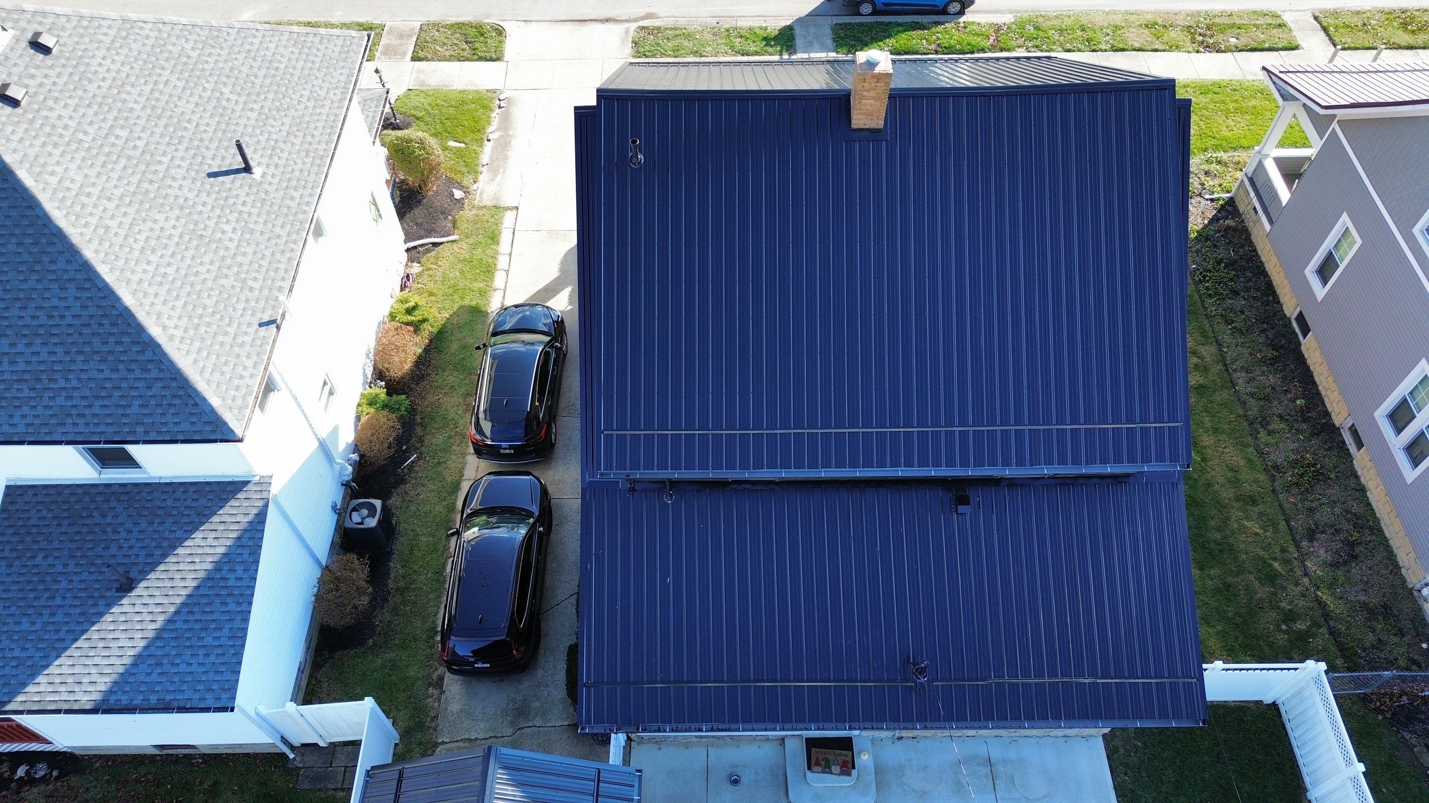Residential Roofing Installation using Perfromance Panel Metal - Black by RoofX 