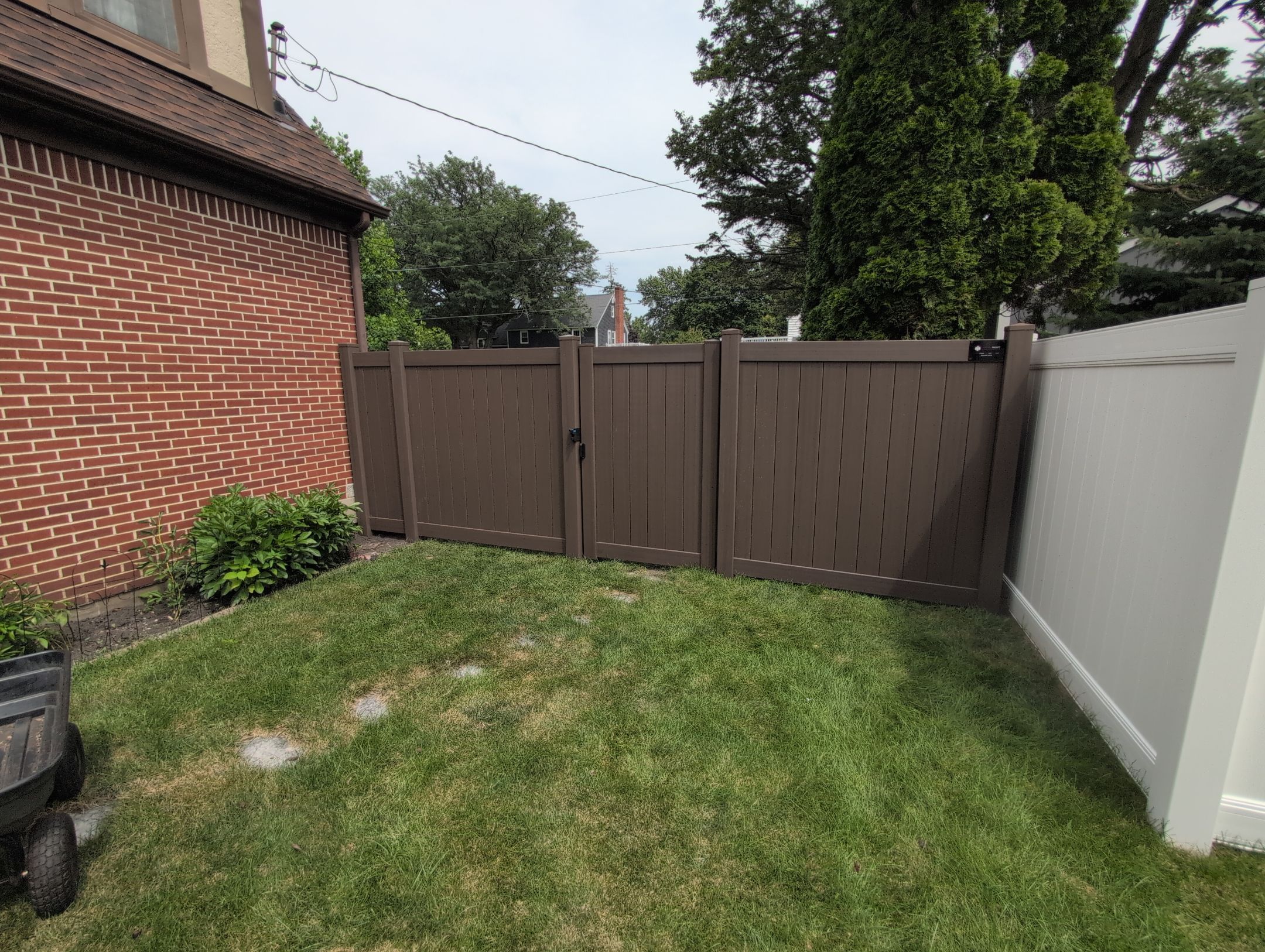 Walnut Vinyl Privacy Fence Installation in Waterloo by Perfect Picket Fence and Stain