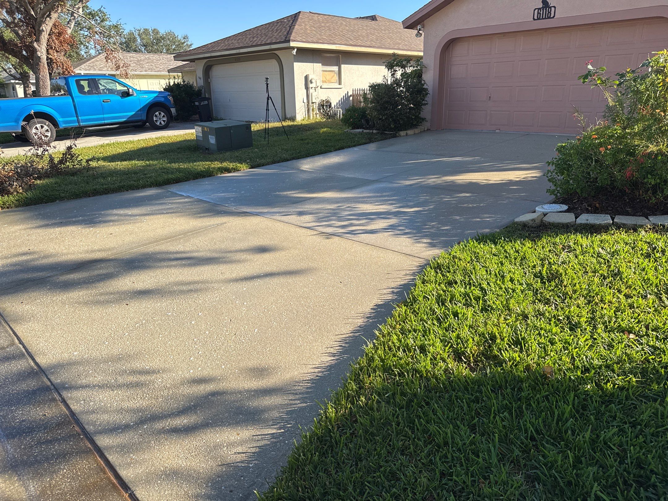 Concrete Driveway, Entryway, Flowerbed Curbing & Statue Cleaning in Heather Glen, Palmetto, FL | Sunshine AquaWash by Sunshine AquaWash