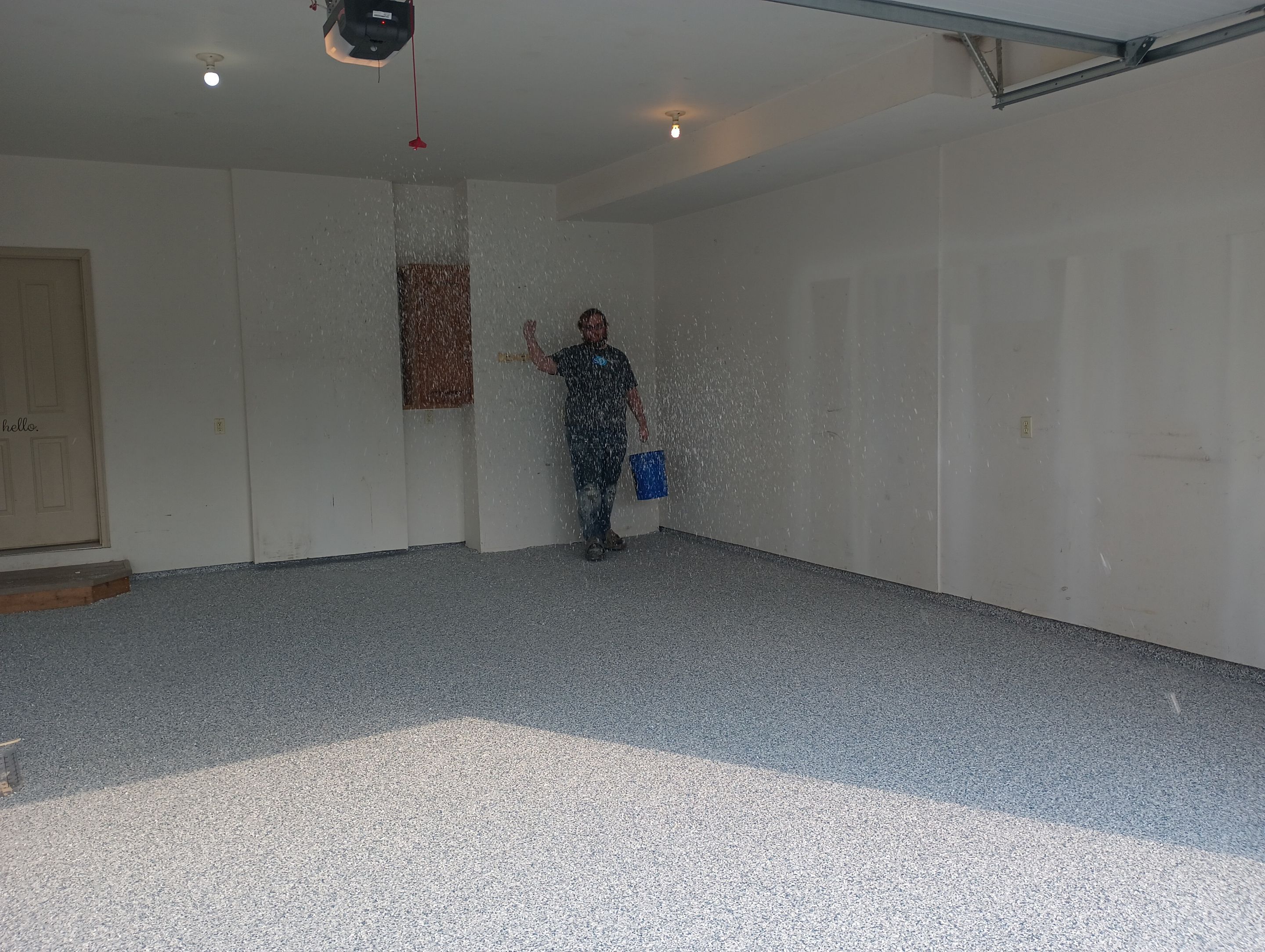 Garage Concrete Coating Installation in Sioux Falls Using Tidal Wave Finish by Select Painting, Coatings & Garage Cabinets