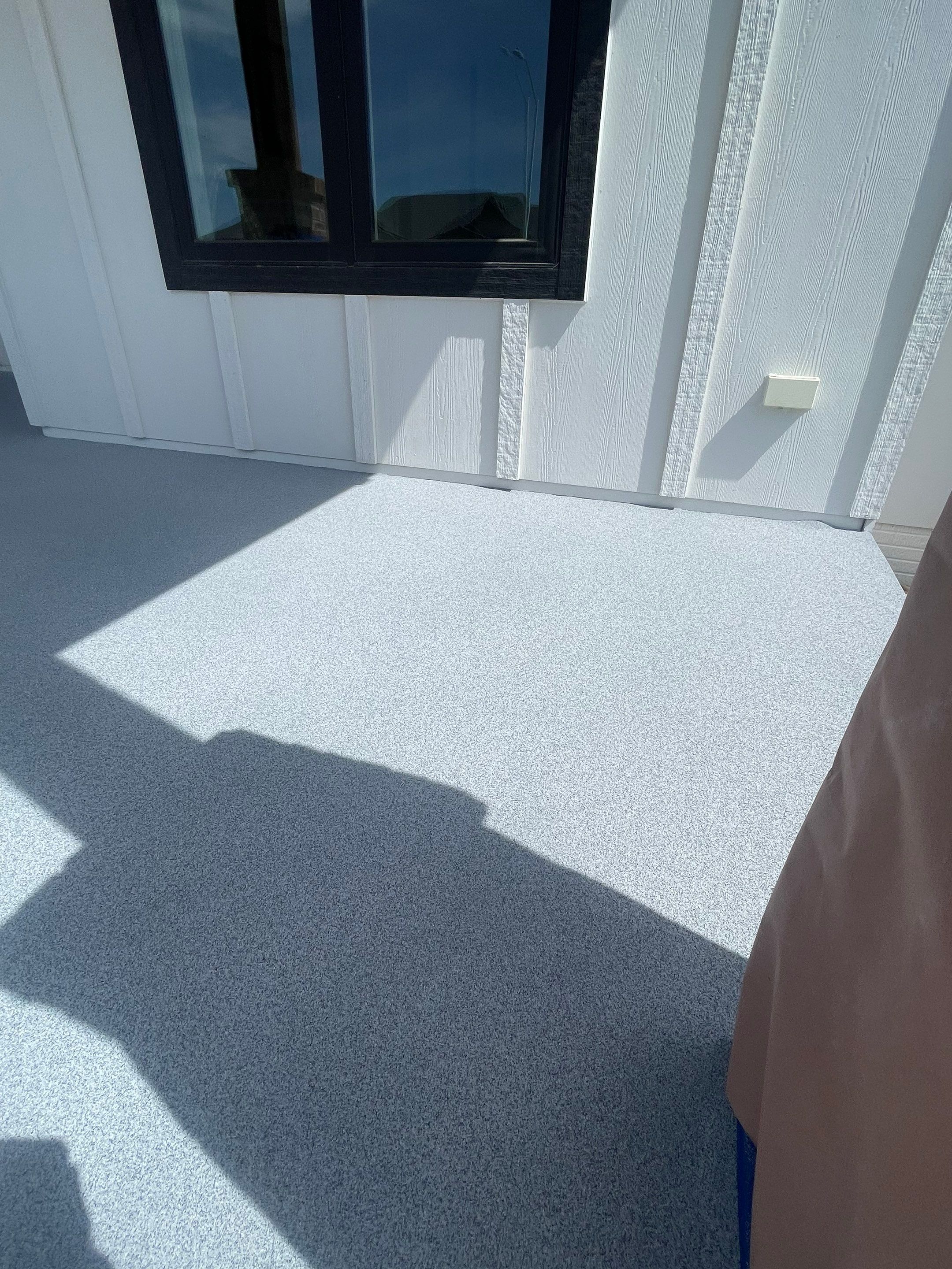 Grey Speckled Concrete Porch Coating for Sioux Falls Home by Select Painting, Coatings & Garage Cabinets