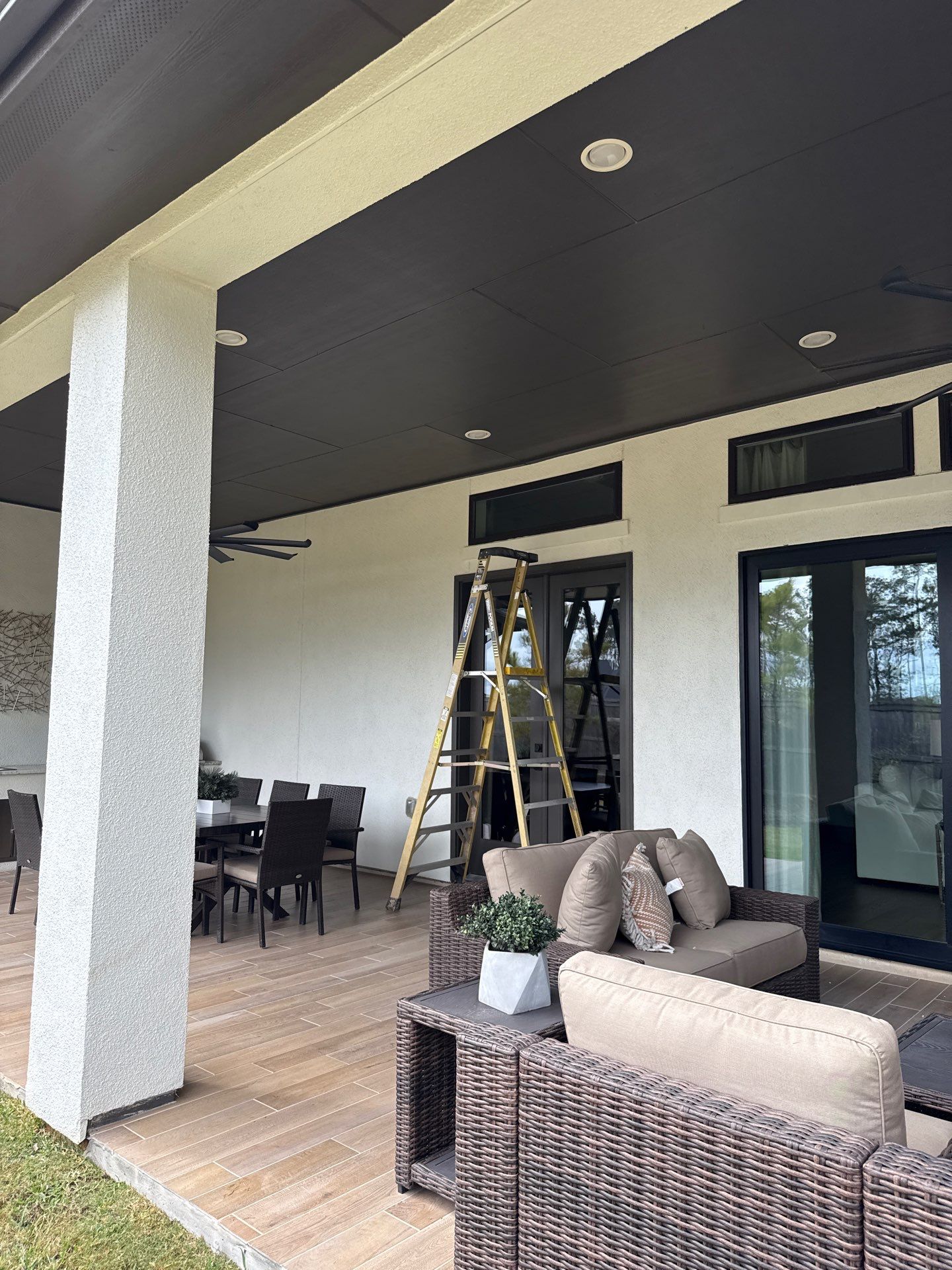 Magnolia Contrast: Light Stucco with Dark Accents and Stone Details by Apex Conventional Stucco Llc