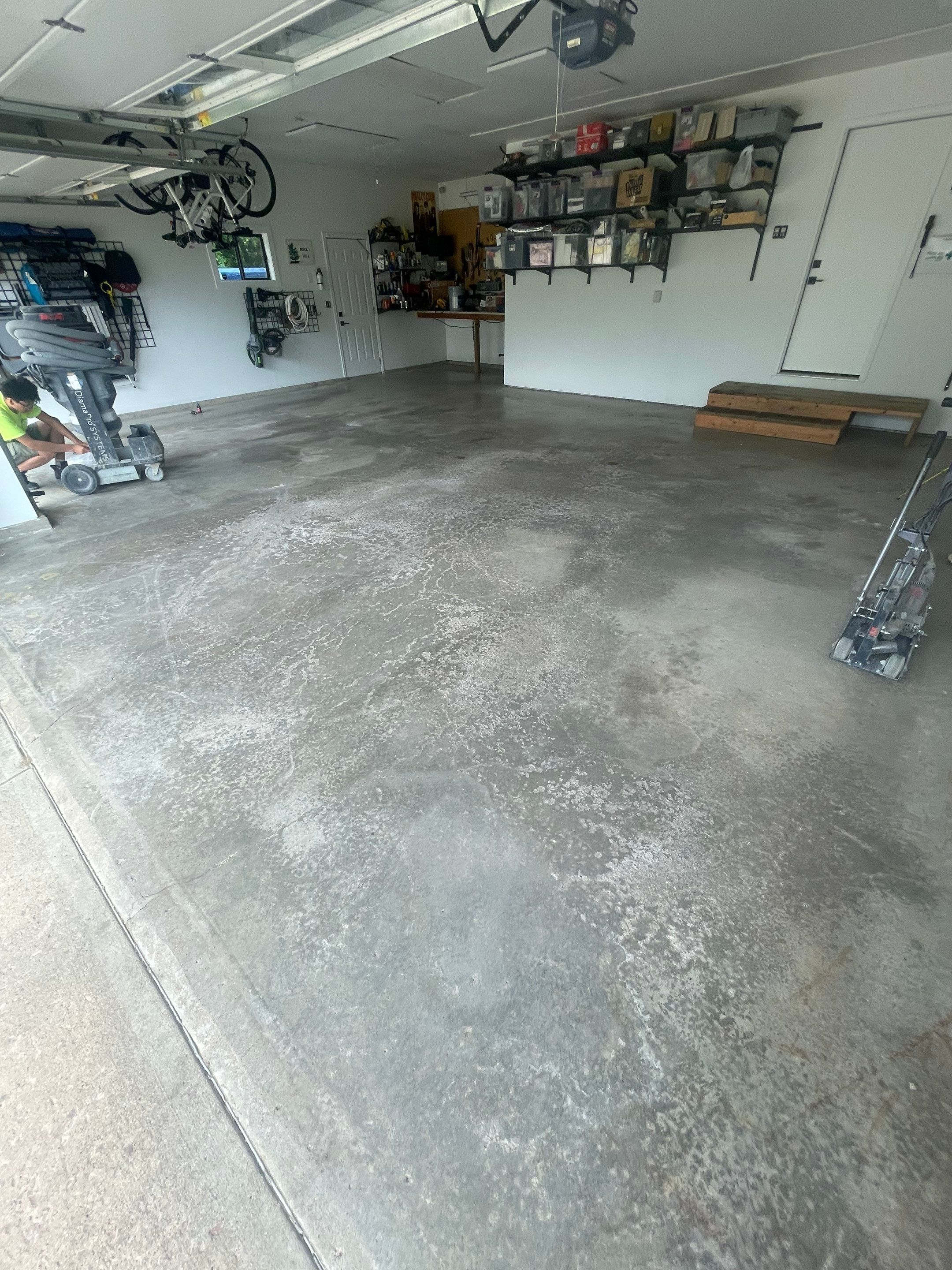 Feather Grey Garage Floor Coating Installation in Sioux Falls by Select Painting, Coatings & Garage Cabinets