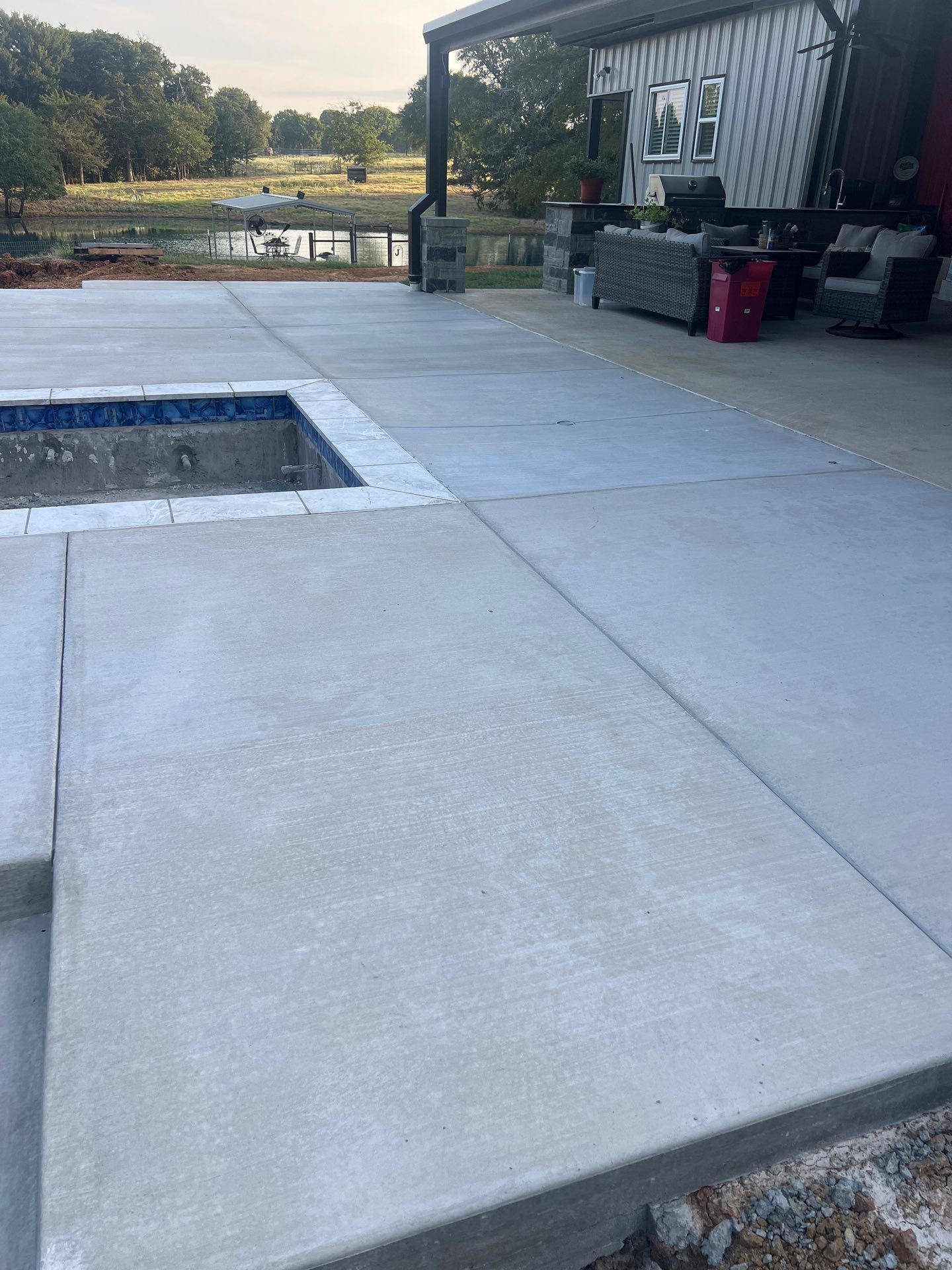 Sleek Rectangular Pool with Dark Interior Finish by Pinnacle Pools and Spas - DFW