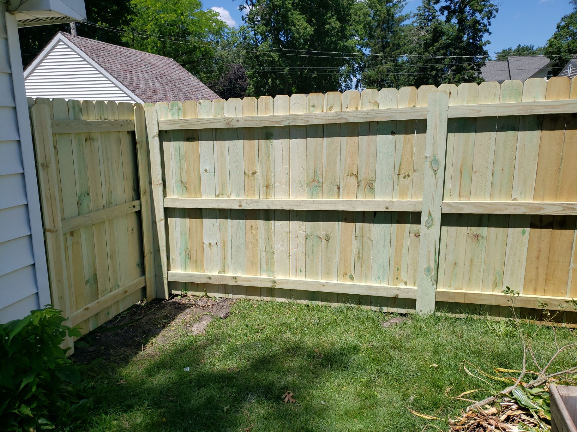 Pressure-Treated Pine Privacy Fence Replacement in Waterloo, Iowa by Perfect Picket Fence and Stain