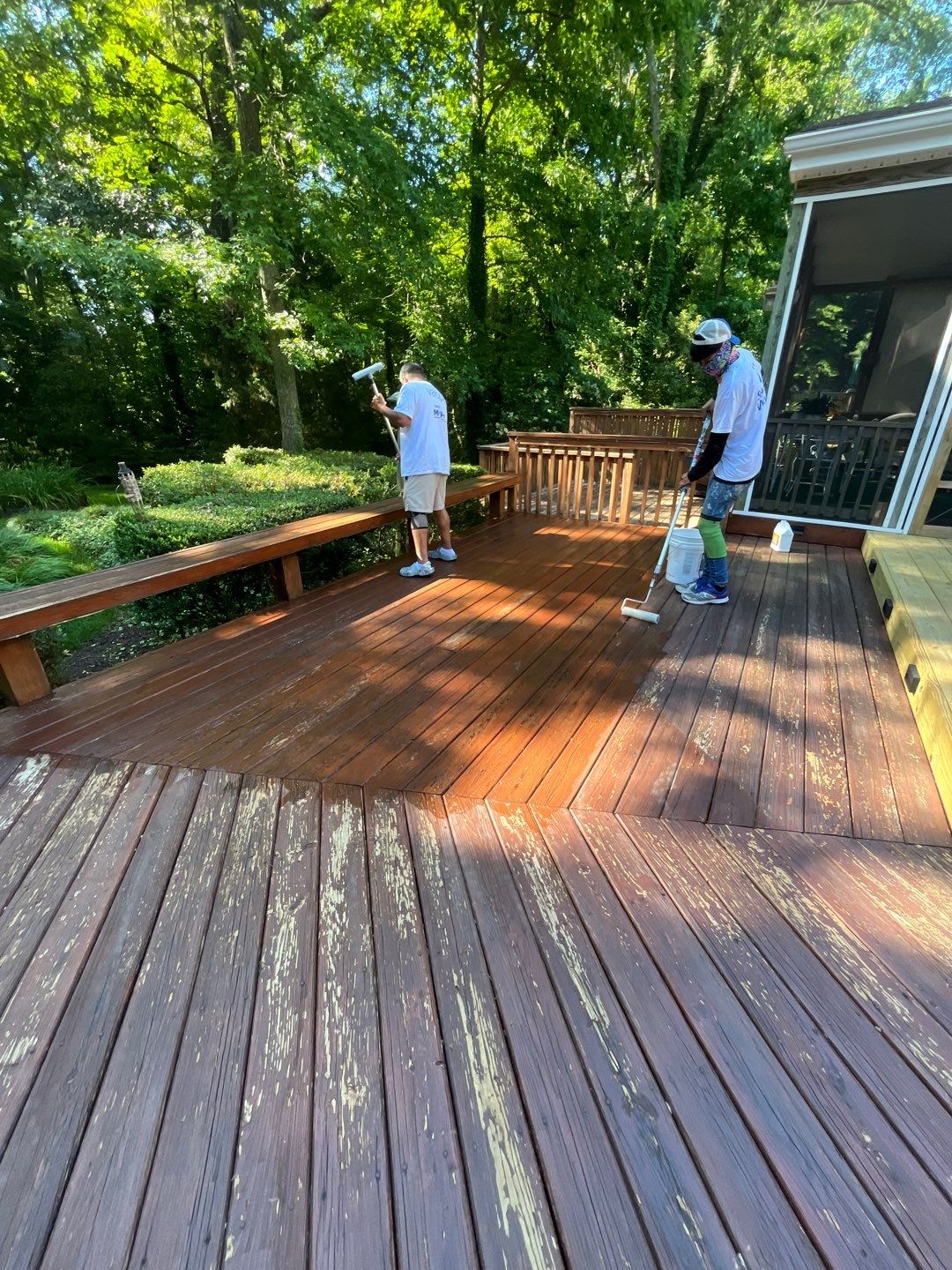 Triple deck re-staining by AKK Painting LLC