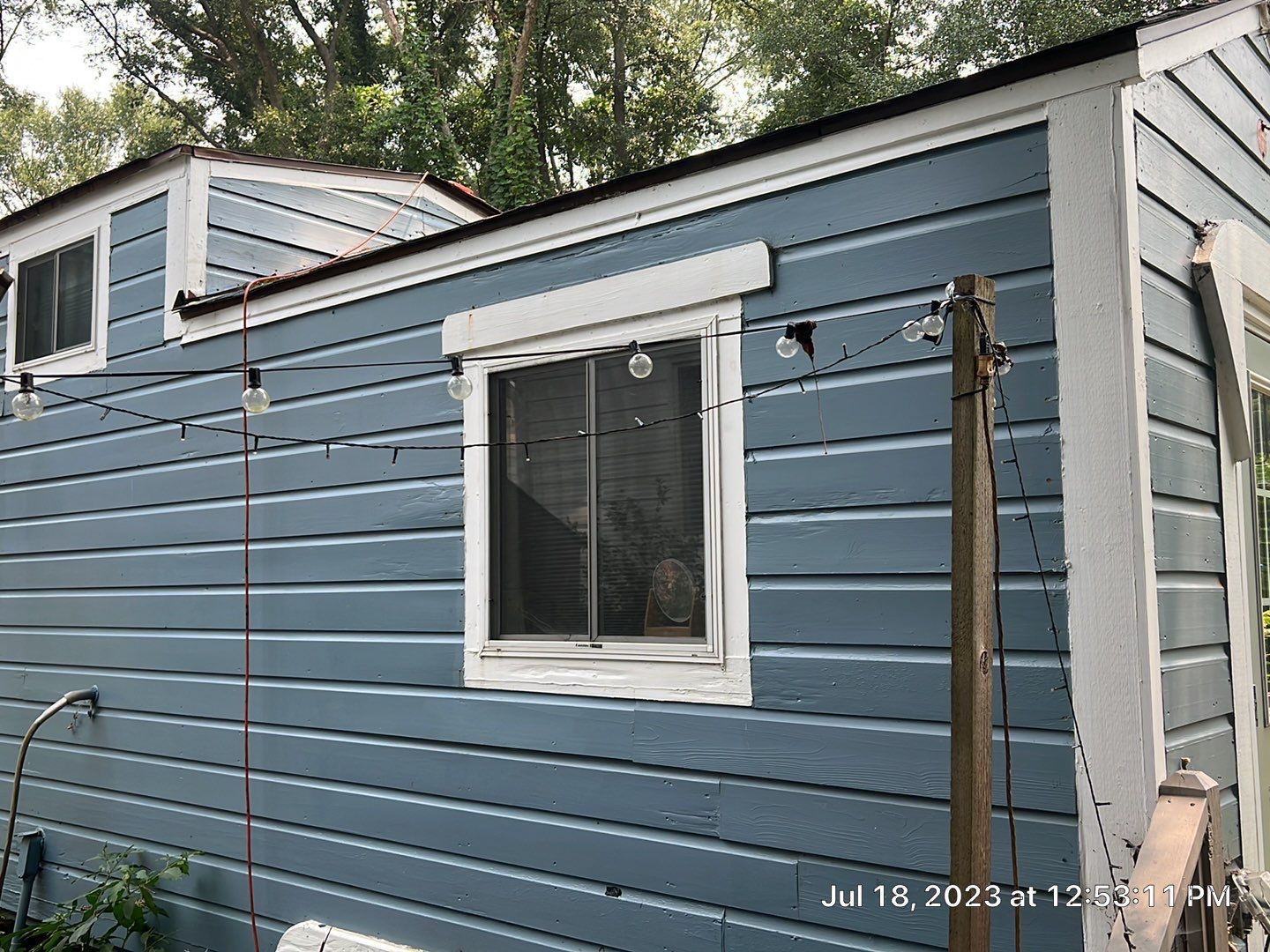 tiny home remodel- siding,paint,roofing by Nailed It Roofing & Remodeling LLC
