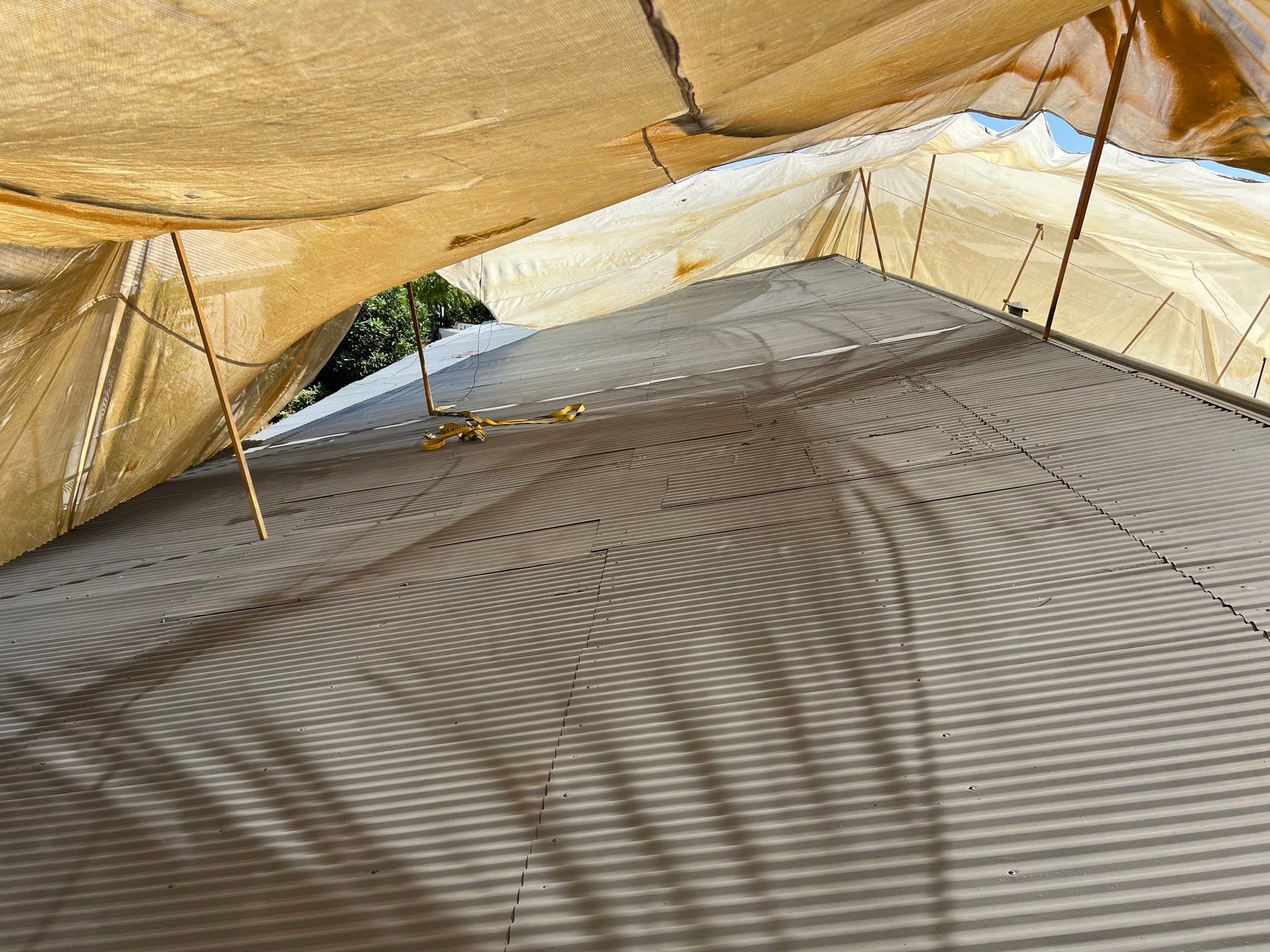 Spray foam and coatings using Conklin Benchmark/ PUMA XL acrylic coatings over metal and foam by Straight Edge Roofing Inc