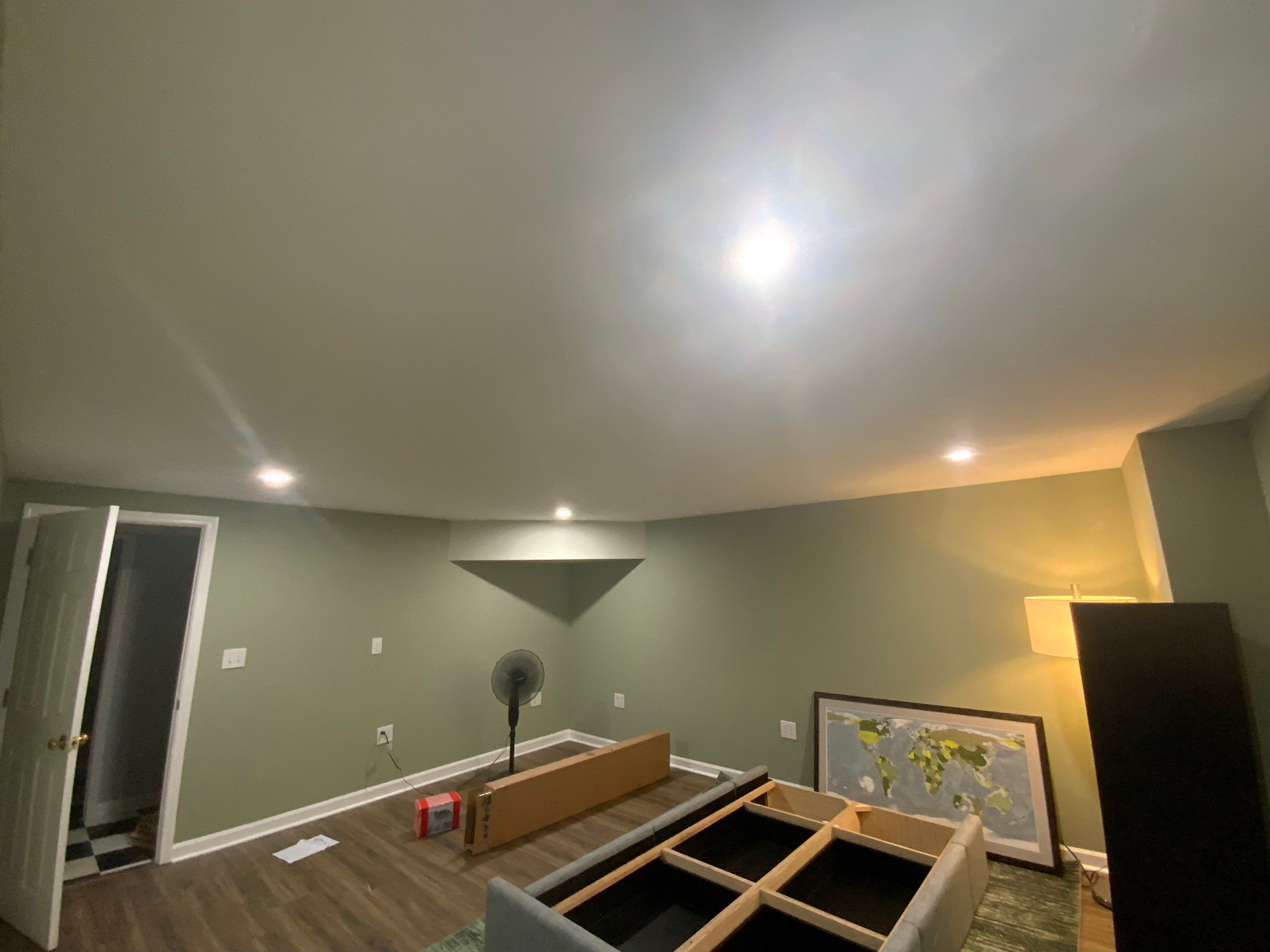 Finished Basement Room Transformation with Wood-Look Flooring in Roswell by Swift Home Renovations
