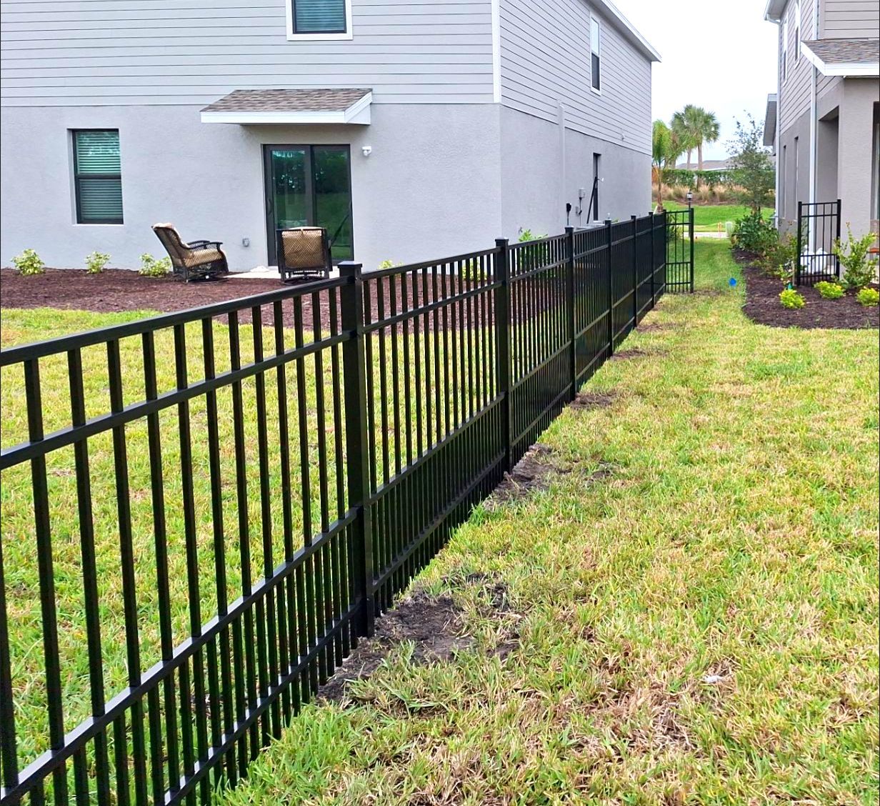 Aluminum Fence Installation using 4ft 3 Rail Black Aluminum Fence by Asap fence and gates, LLC