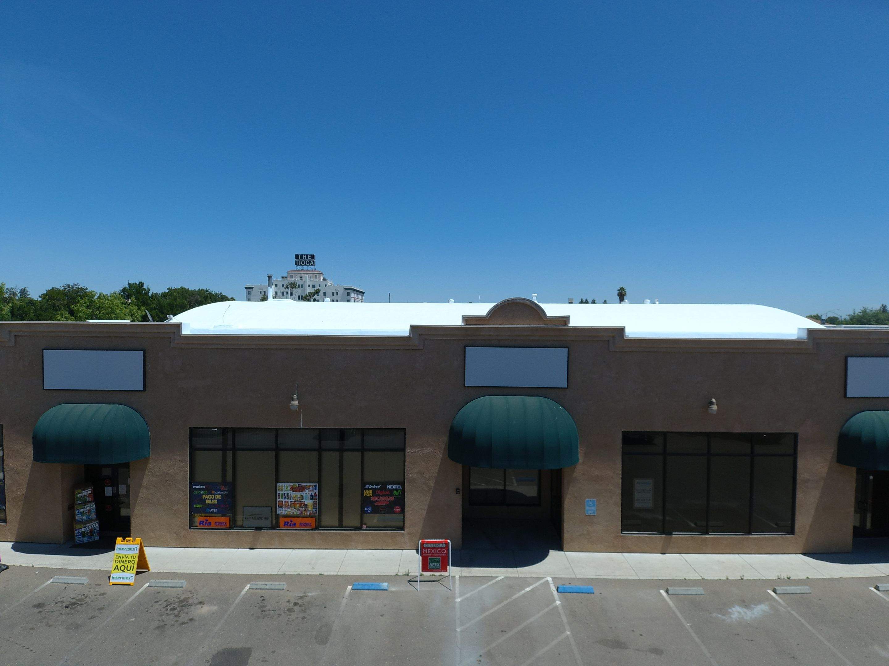 Spray foam and coatings using Conklin Benchmark/PUMA XL coatings and spray foam by Straight Edge Roofing Inc