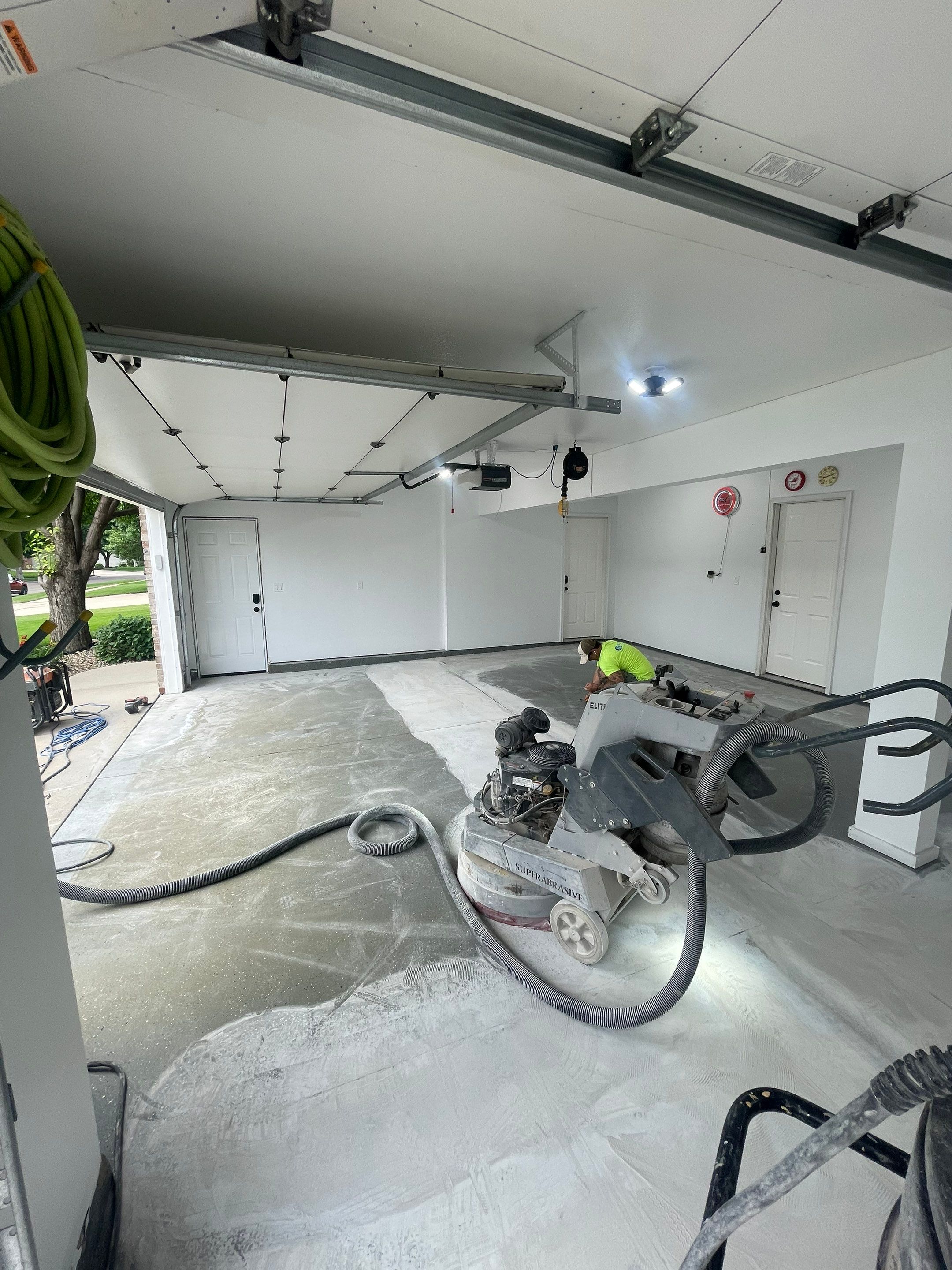 Multi-Car Garage Concrete Coating with Coyote Flake Finish in Sioux Falls by Select Painting, Coatings & Garage Cabinets