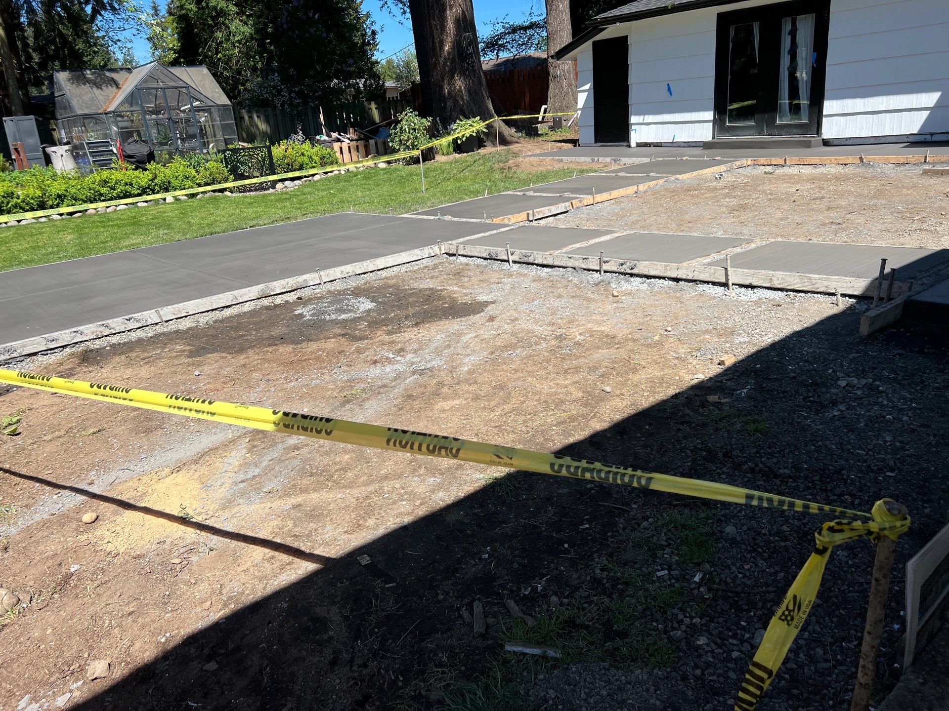 John | Concrete Backyard Walkway by Jireh Asphalt & Concrete Inc 