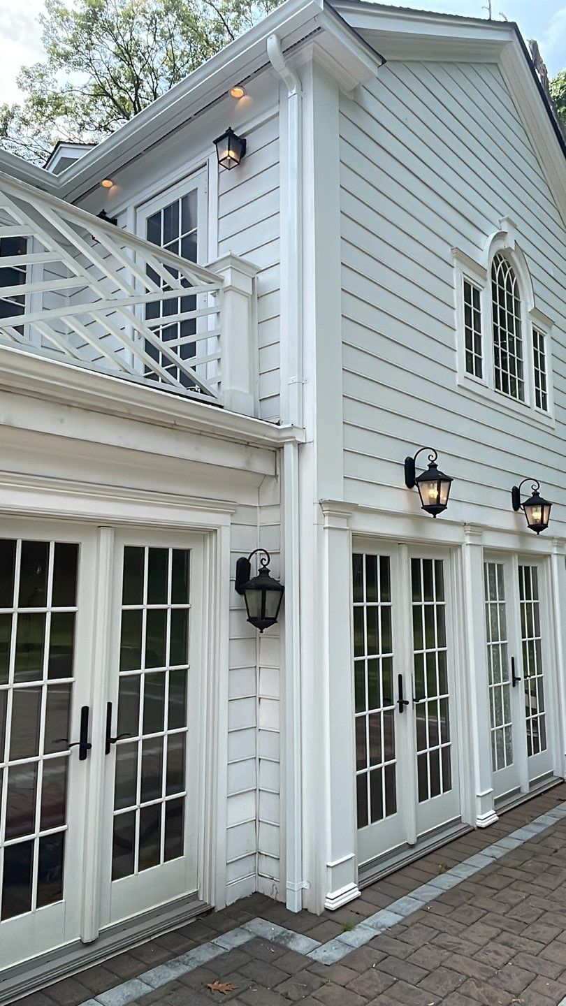 Gutter Installation using 5"white K style seamless gutters and 2x3 white leaders by Above All Gutters 