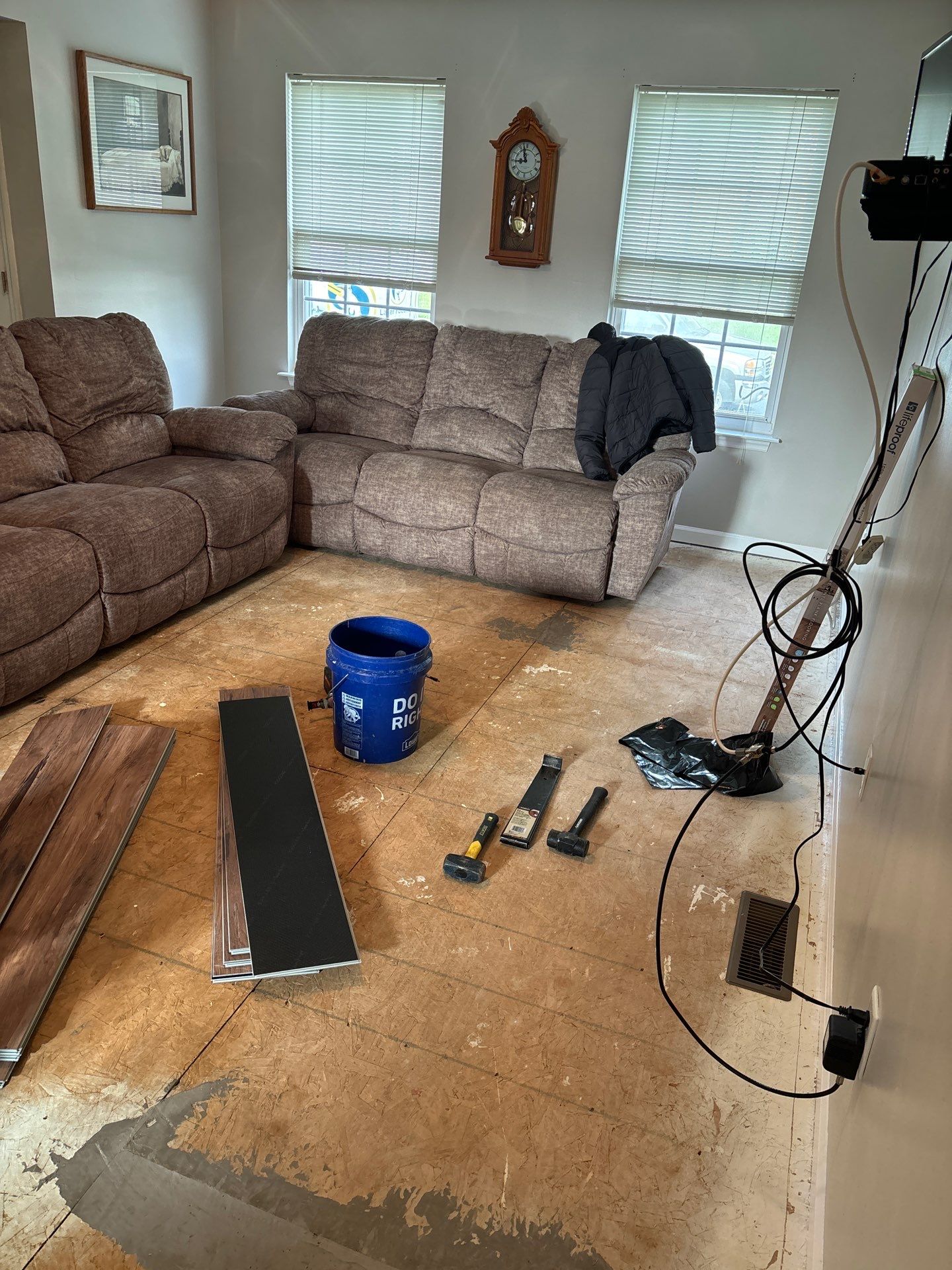 Living room LVP Flooring install  by Laser Focused Solutions LLC